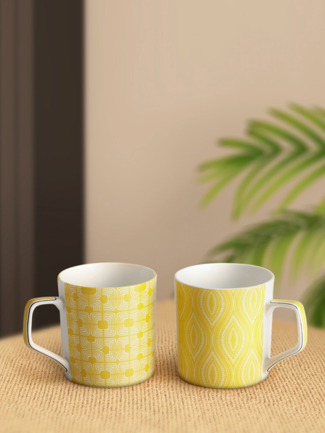 

Living scapes by Pantaloons Set Of 2 Yellow & Off White Bone China Glossy Cups 220ml each