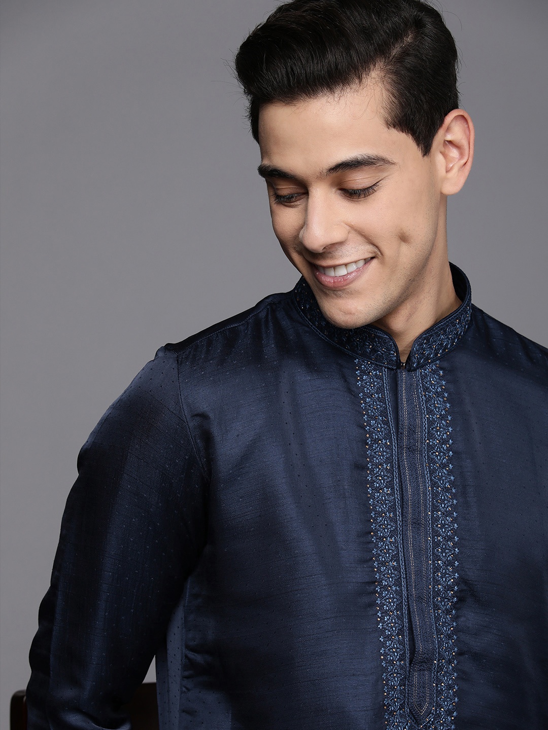 

Manyavar Men Blue Solid Kurta with Churidar