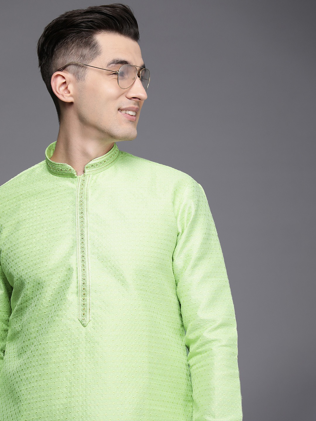 

Manyavar Men Green Solid Kurta with Churidar