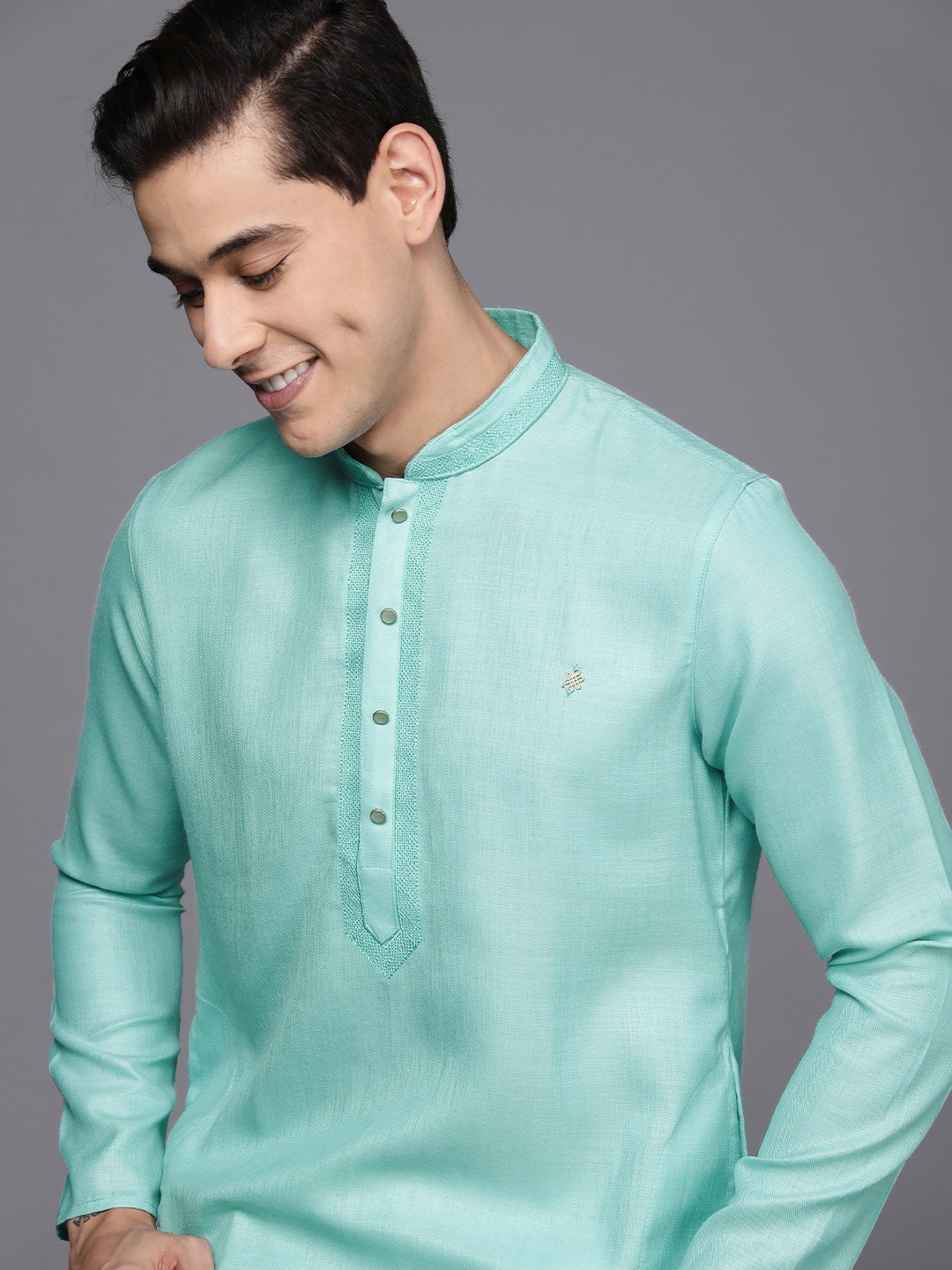 

Manyavar Men Blue Solid Kurta with Churidar