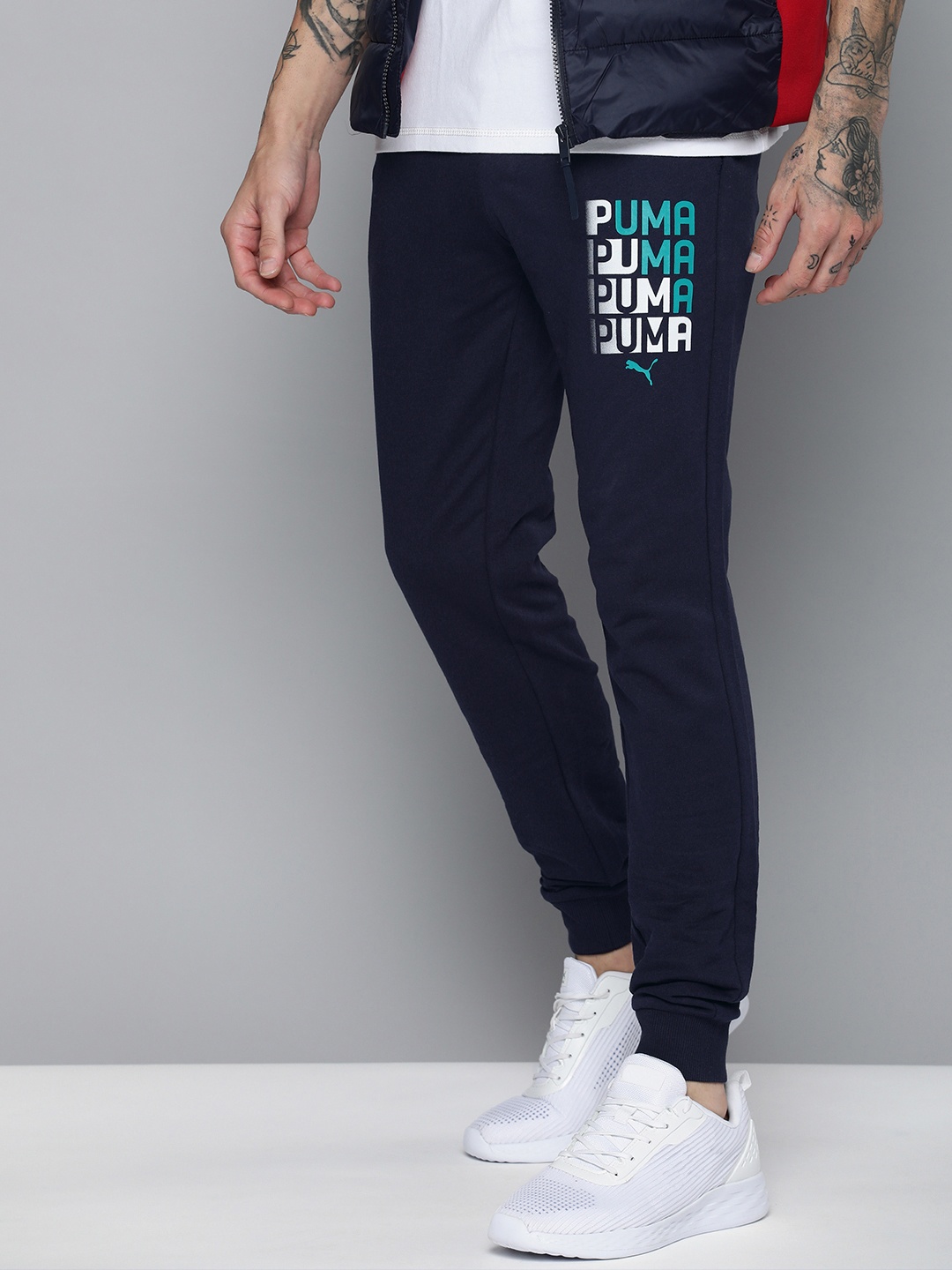 

PUMA Men Brand Logo Printed Graphic Slim Fit Joggers, Blue