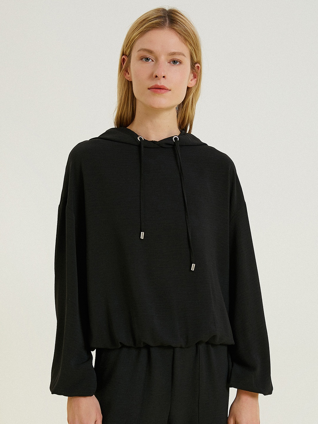 

Koton Women Black Solid Hooded Sweatshirt