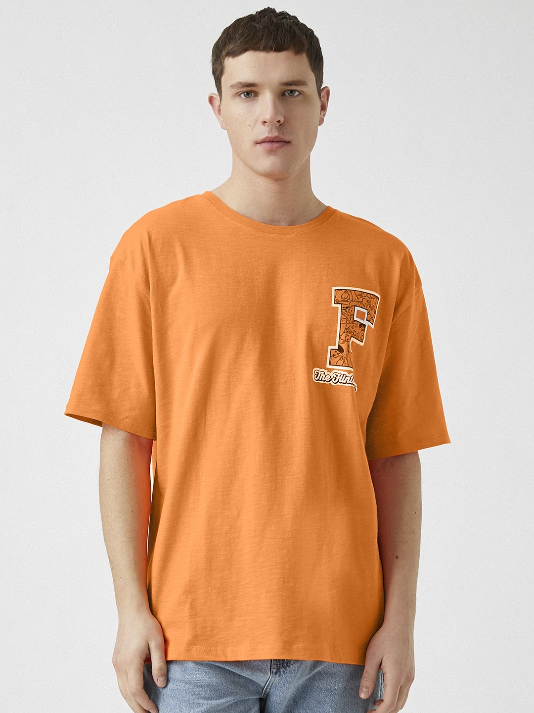 

Koton Men Orange Typography Printed Drop-Shoulder Sleeves Pure Cotton T-shirt