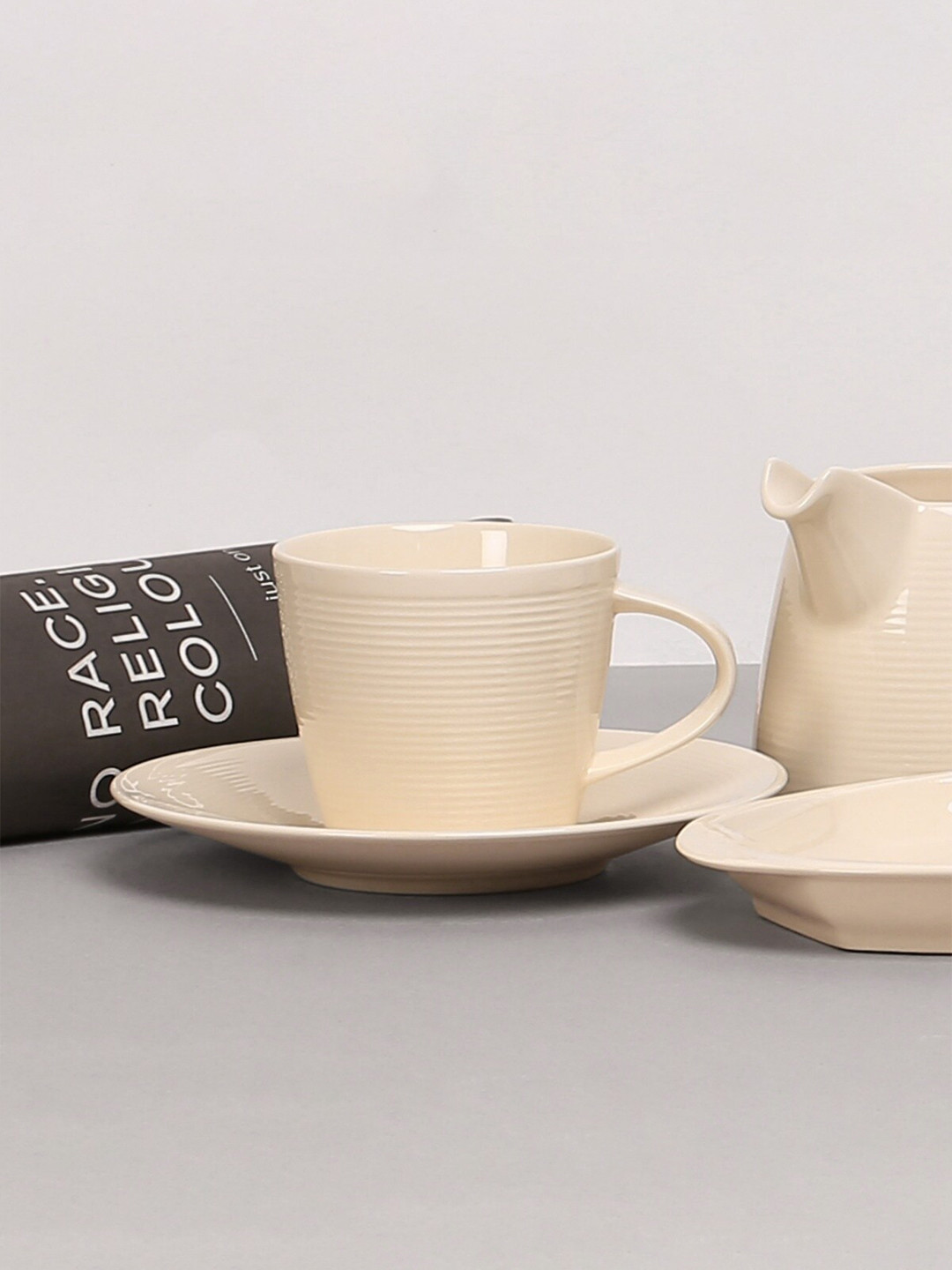 

Home Centre Beige Textured Dishwasher safe Ceramic Glossy Cup and Saucer 200ml