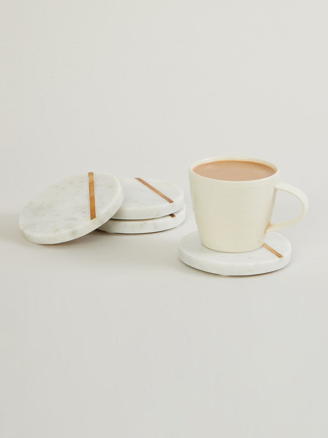 

Home Centre Set of 4 White Printed Marble Coasters