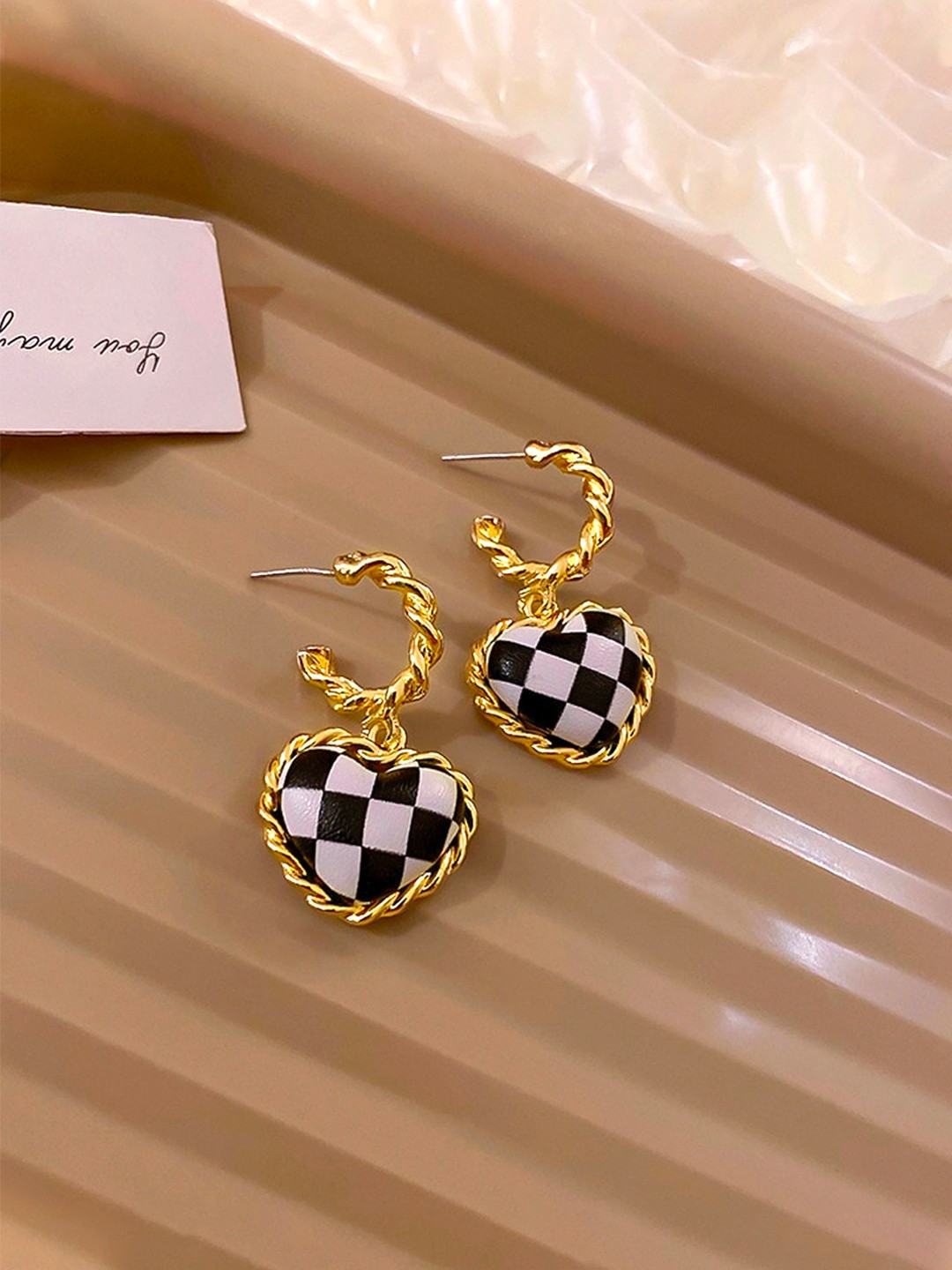 

Unwind by Yellow Chimes Black Contemporary Half Hoop Earrings