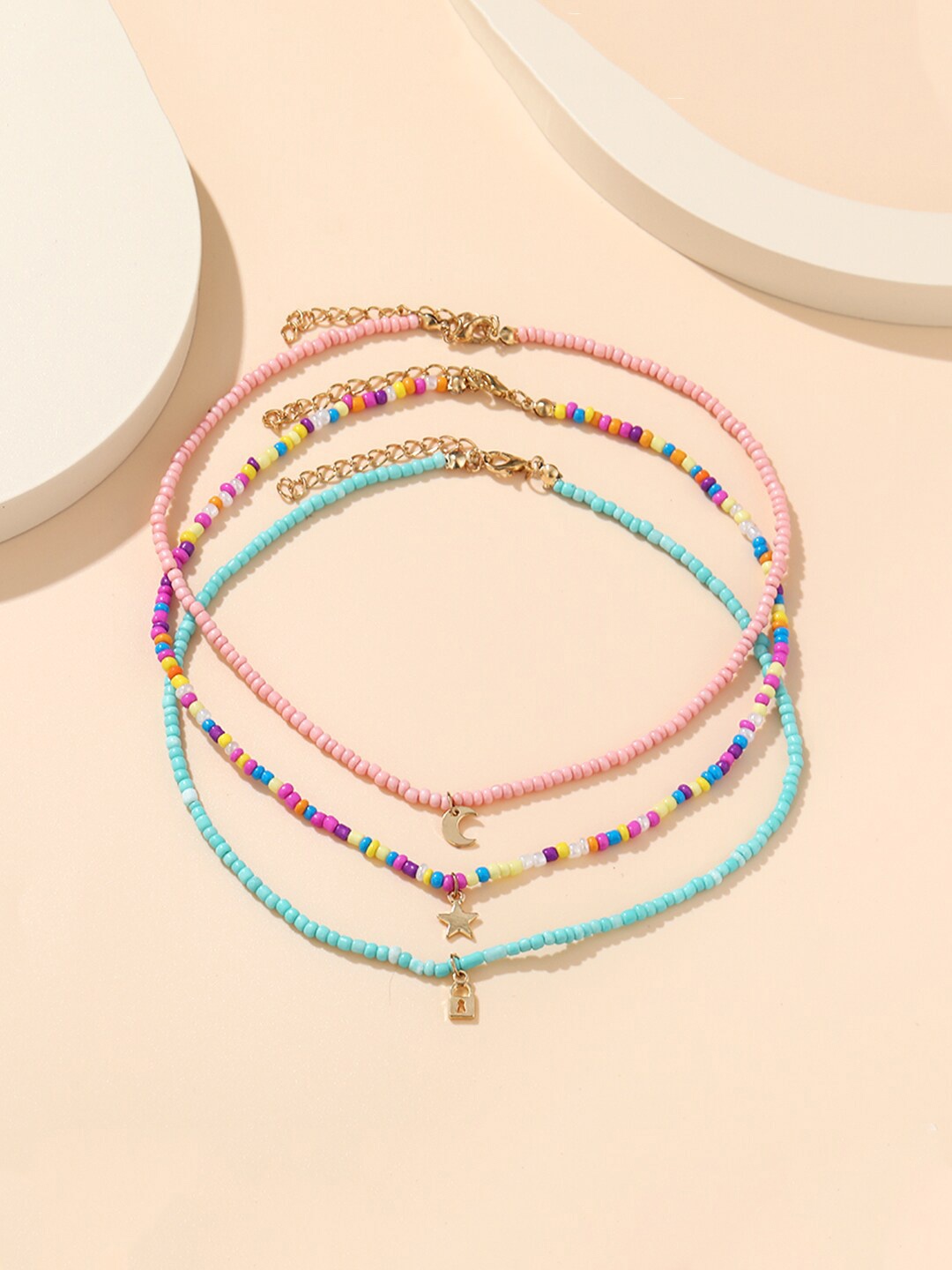 

Unwind by Yellow Chimes Multicolored Star Moon Lock Shaped Beadded Multilayer Necklace, Multi