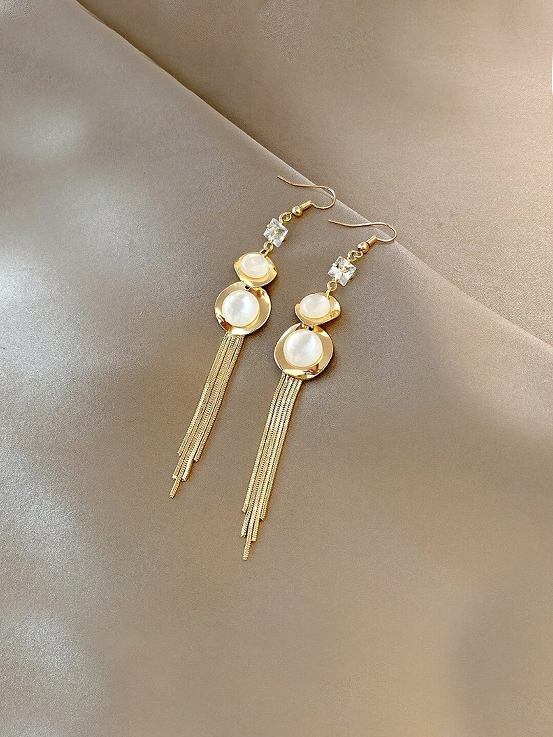 

Unwind by Yellow Chimes Gold-Plated White Stone Studded Long Dangler Earrings