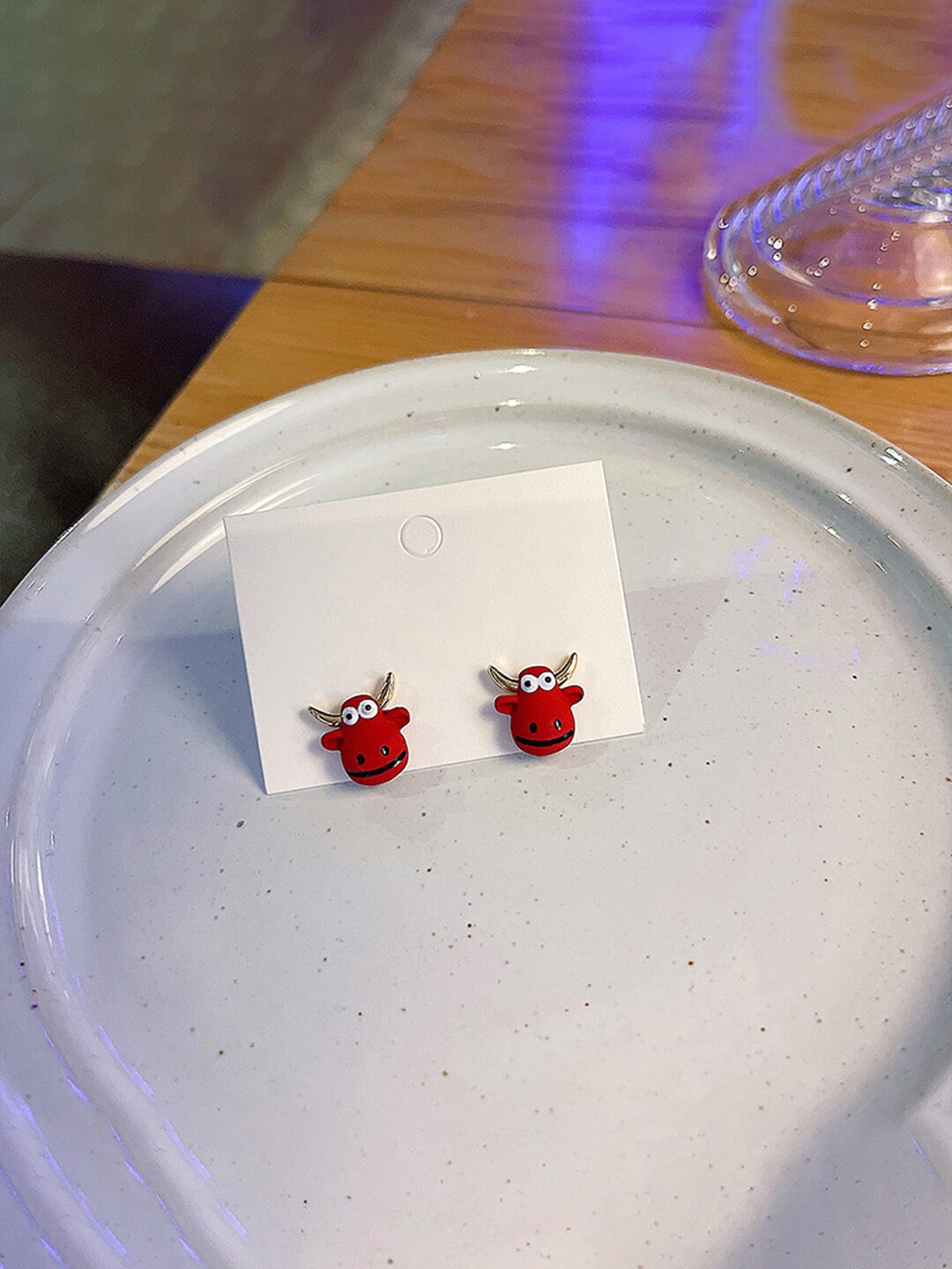 

Unwind by Yellow Chimes Woman Red Contemporary Bull Head Studs Earrings