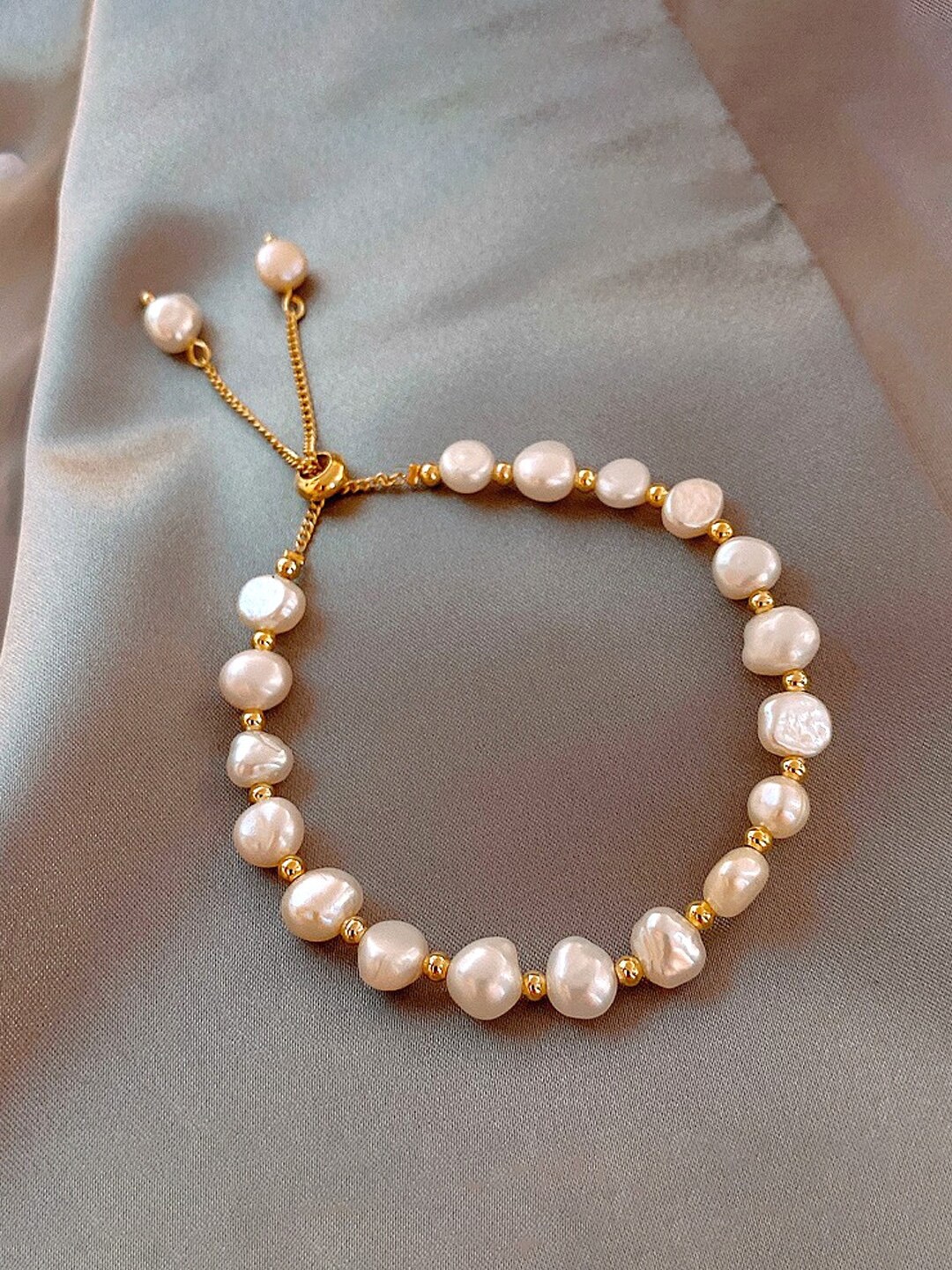 

Yellow Chimes Women Gold Toned Pearl Beaded Adjustable Bracelet