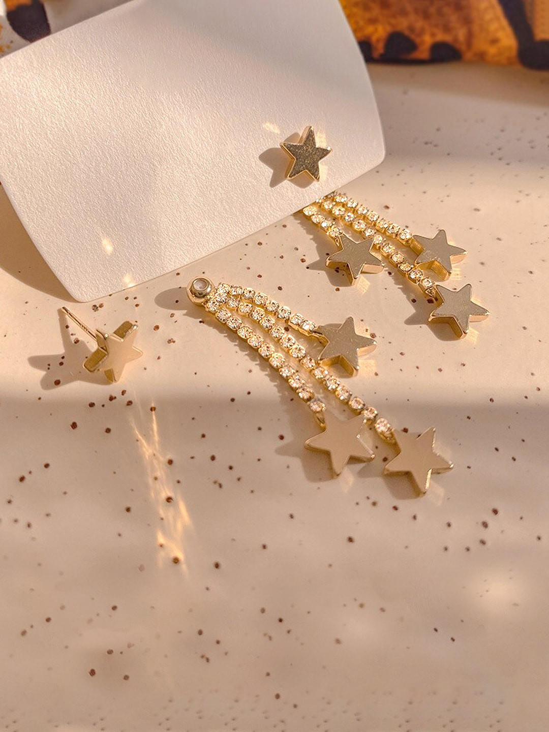 

Yellow Chimes Women Gold-Toned Star Shaped Stud With Chain Back Drop Earrings