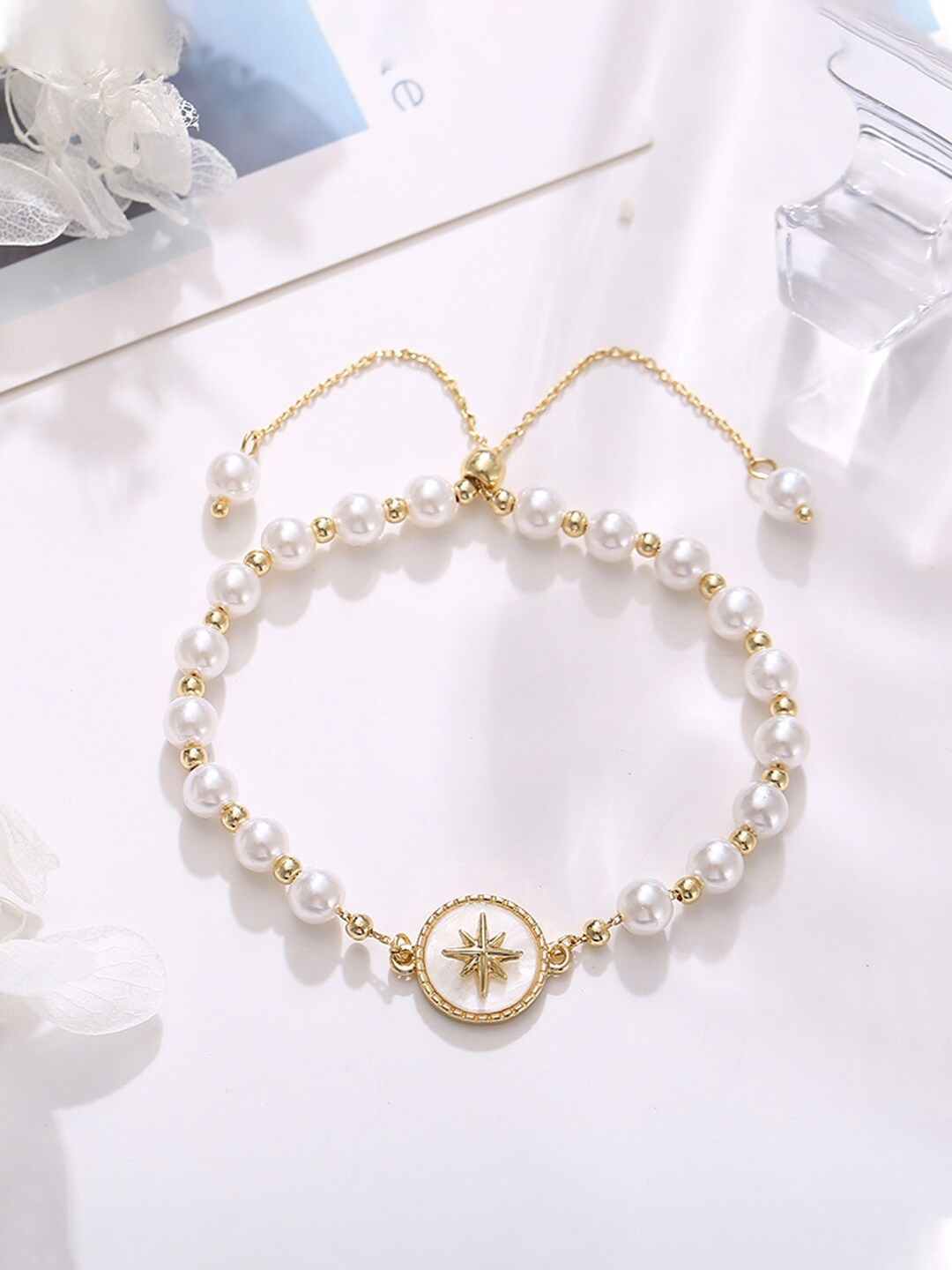 

Yellow Chimes Women Gold Tone Pearl Beaded Adjustable With Centre Charm Bracelet