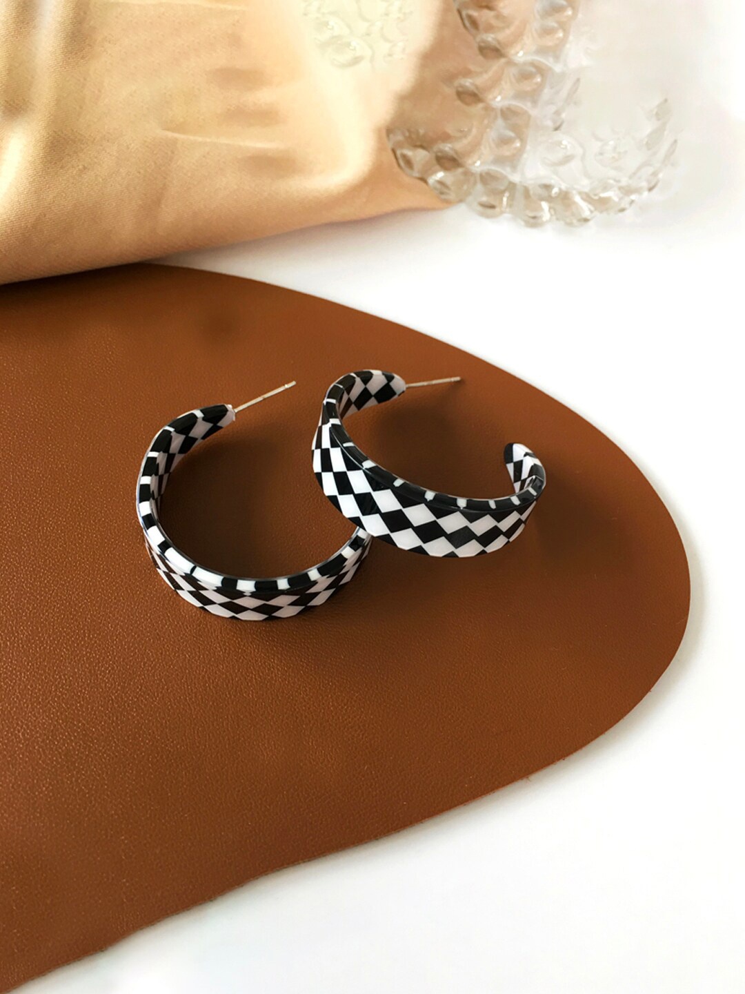 

Unwind by Yellow Chimes Black Contemporary Half Hoop Earrings