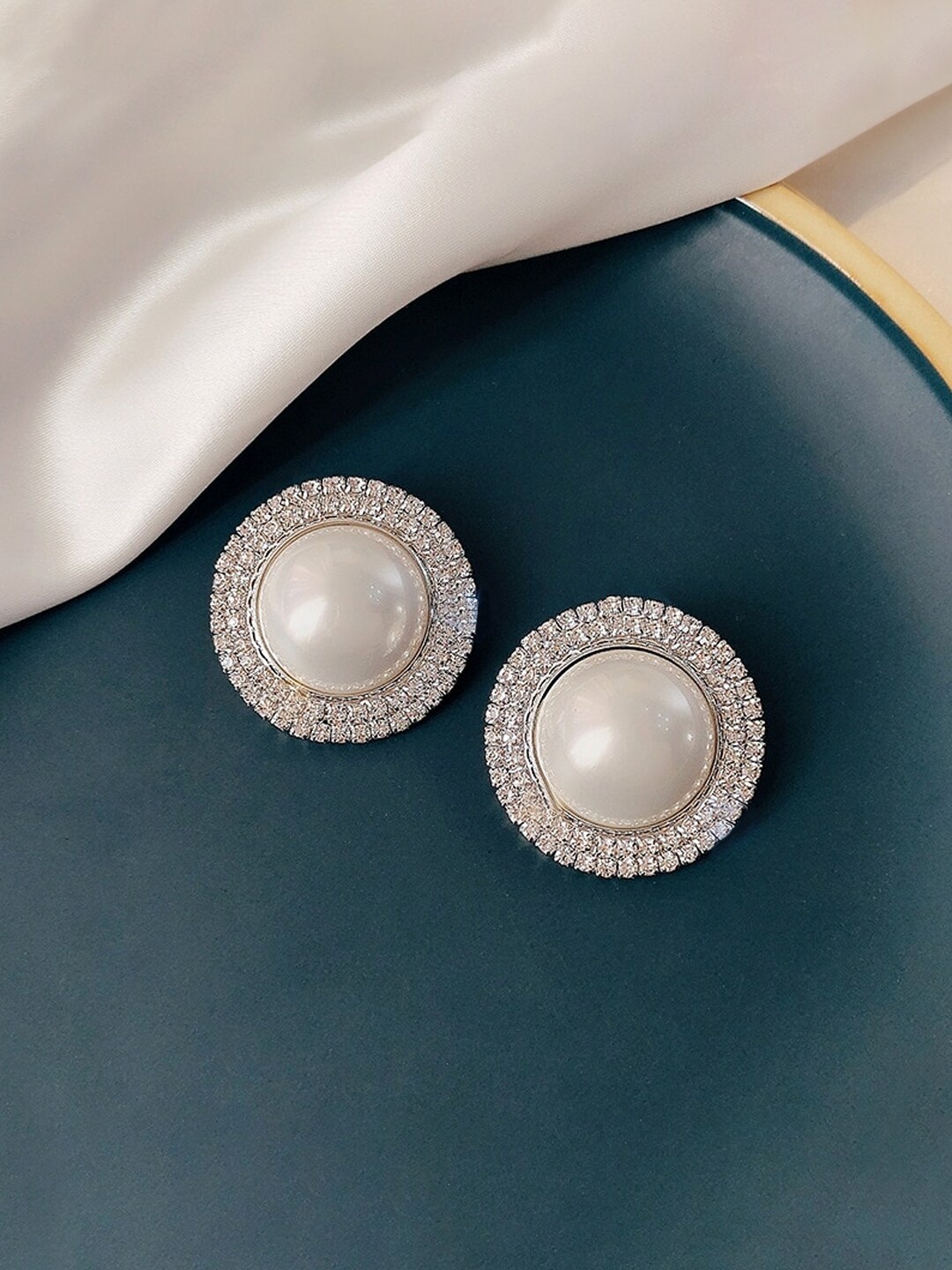 

Unwind by Yellow Chimes Silver-Toned White Pearl & Crystal Studded Circular Stud Earrings