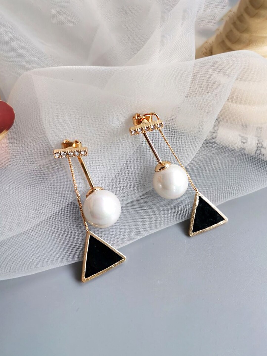 

Unwind by Yellow Chimes Black Pearl Studded Geometric Drop Earrings