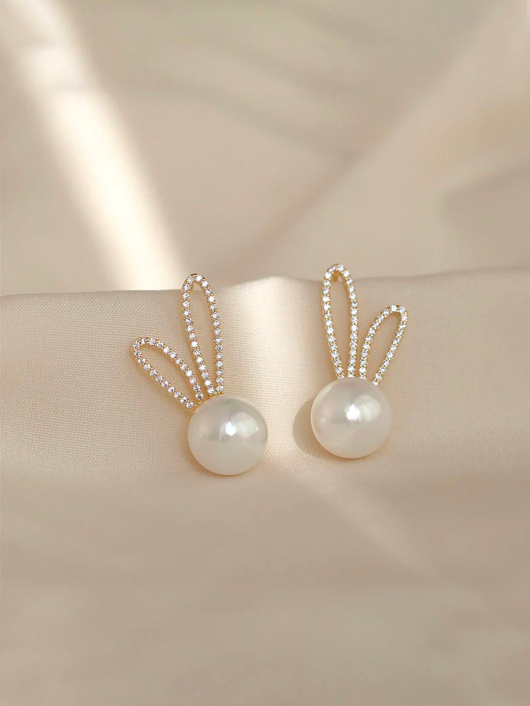 

Yellow Chimes Gold-Toned Pearl Drop Crystal Studded Oval Shape Stud Earrings