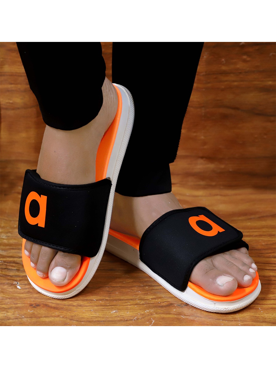 

aadi Men Orange & Black Rubber Casual Sliders