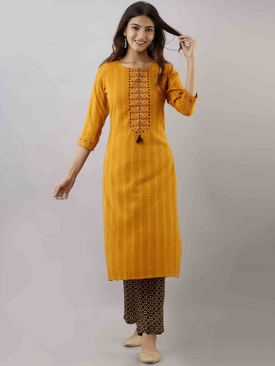 

KALINI Women Mustard Yellow Embroidered Kantha Work Kurta with Trousers