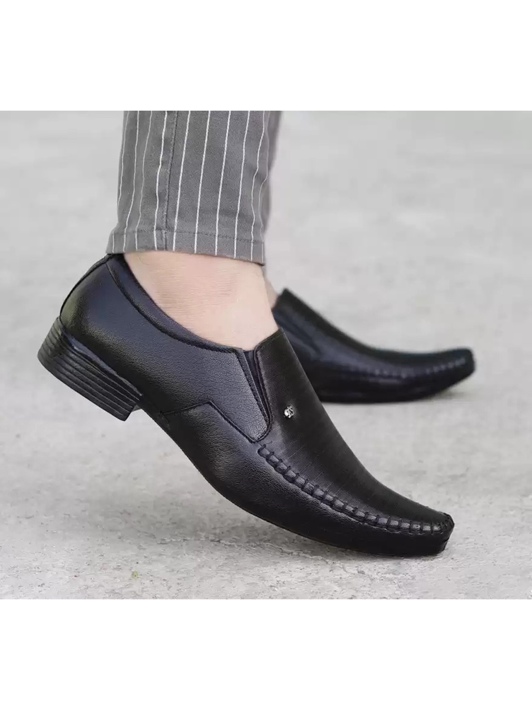 

aadi Men Black Solid Formal Slip-On Shoes