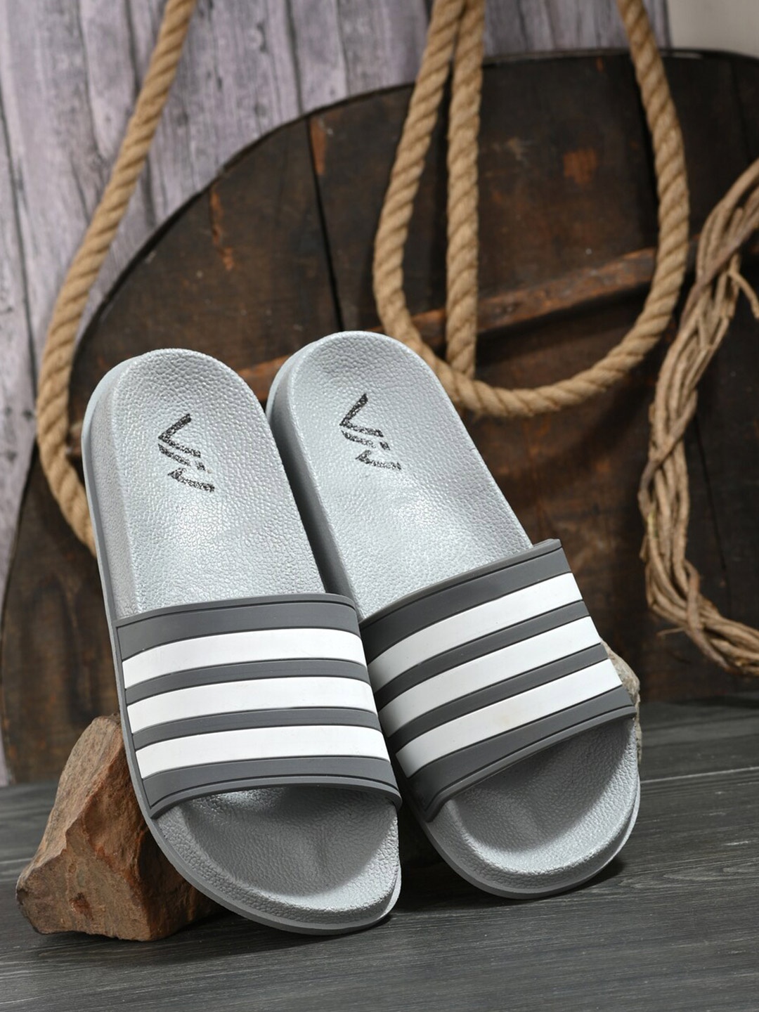 

VIV Men Grey & White Striped Rubber Sliders