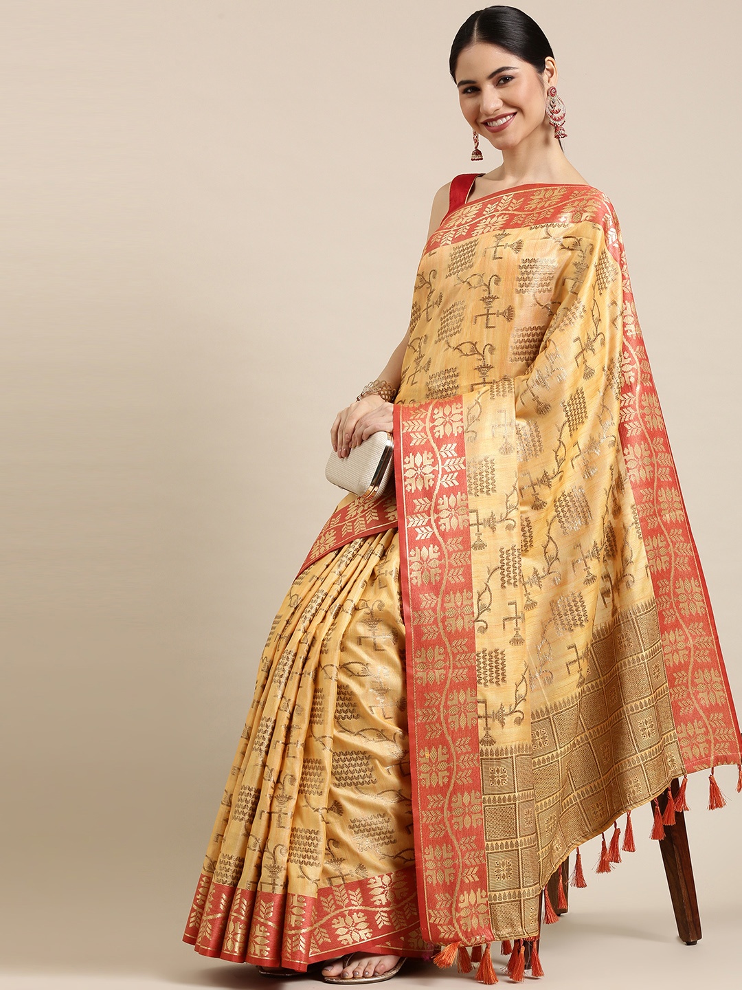 

Mitera Orange & Golden Ethnic Motifs Zari Silk Blend Kanjeevaram Saree