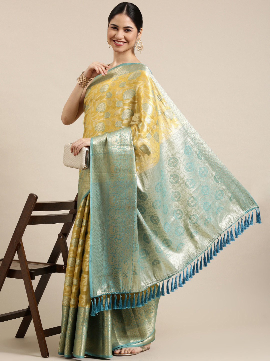 

Mitera Yellow & Silver-Toned Ethnic Motifs Zari Silk Blend Kanjeevaram Saree