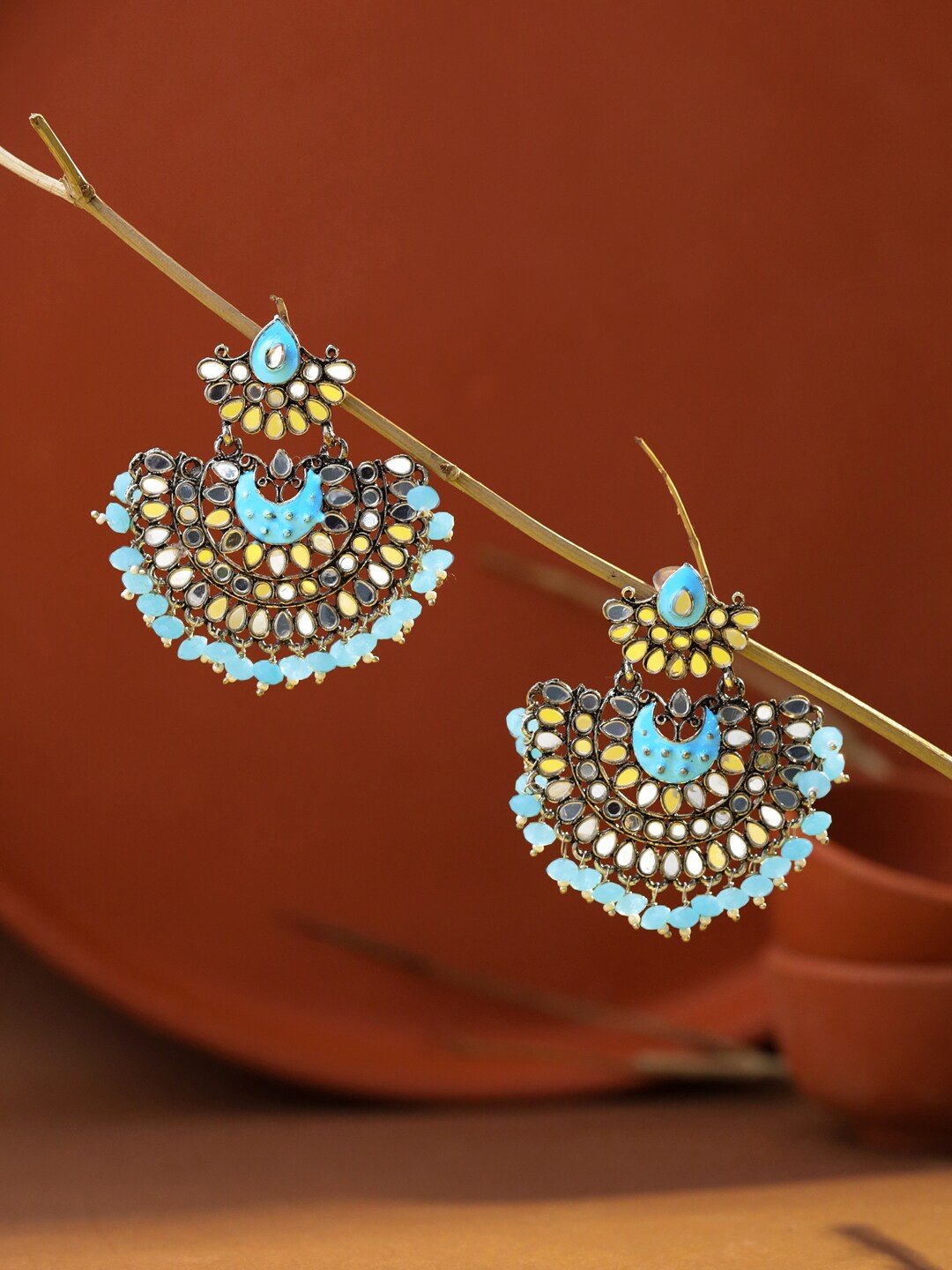 

Yellow Chimes Women Blue Pearl and Stone Studded Chandbalis Earrings