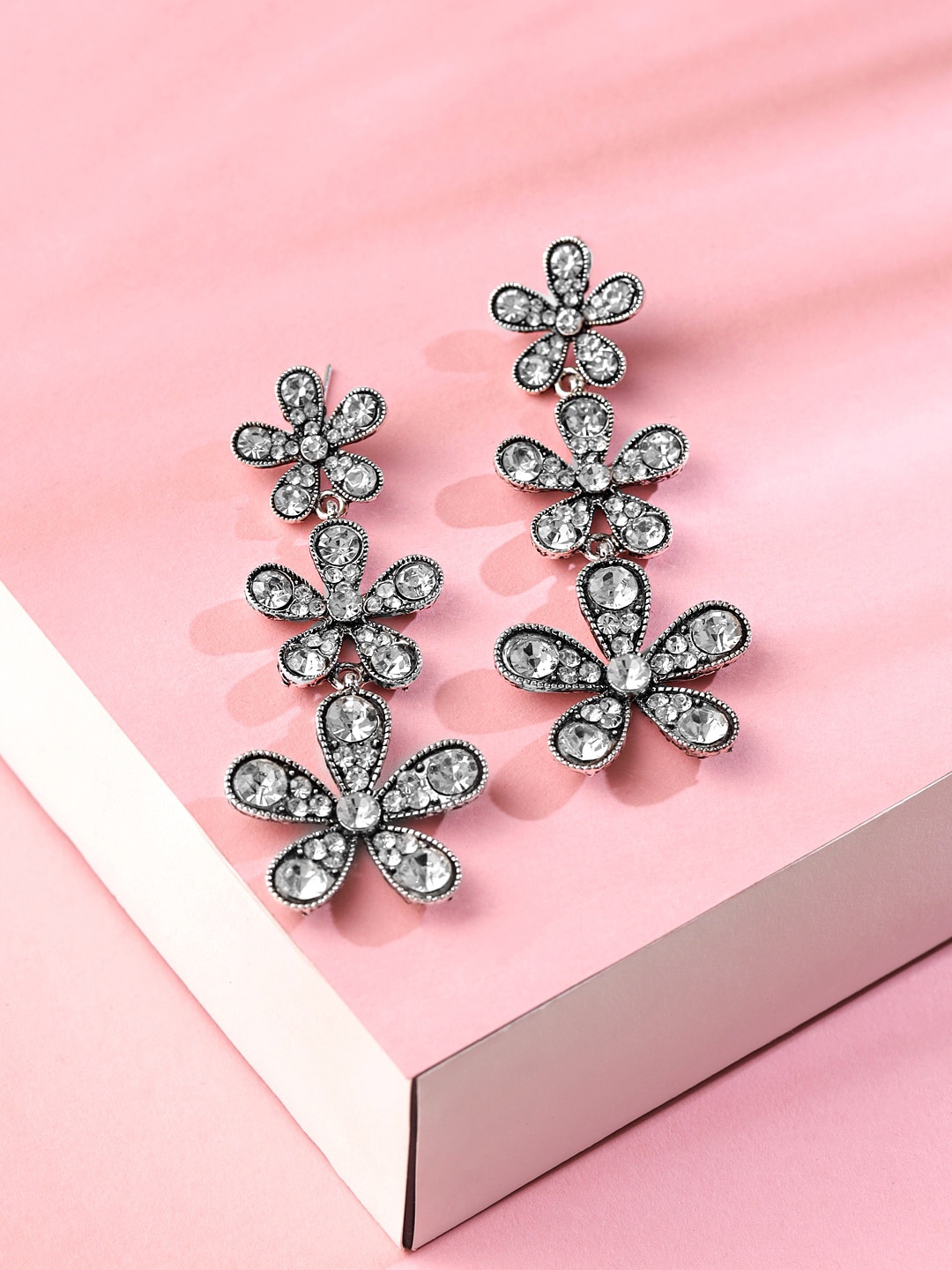 

Yellow Chimes Silver-Plated Oxidised Flower Crystal Studded Dangler Earrings
