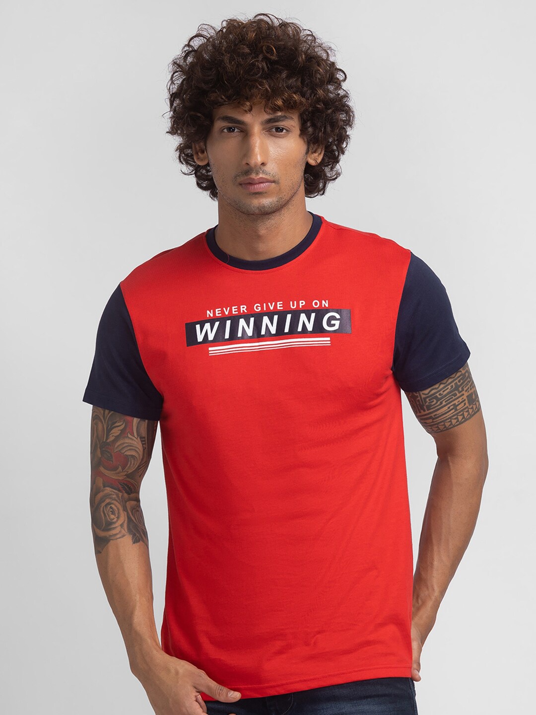 

Globus Men Red and Navy Blue Typography Colourblocked T-shirt