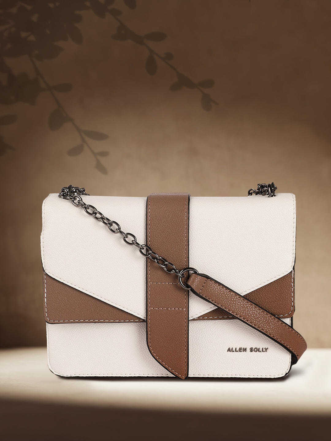 

Allen Solly Off White Solid PU Regular Structured Sling Bag with Applique Detail