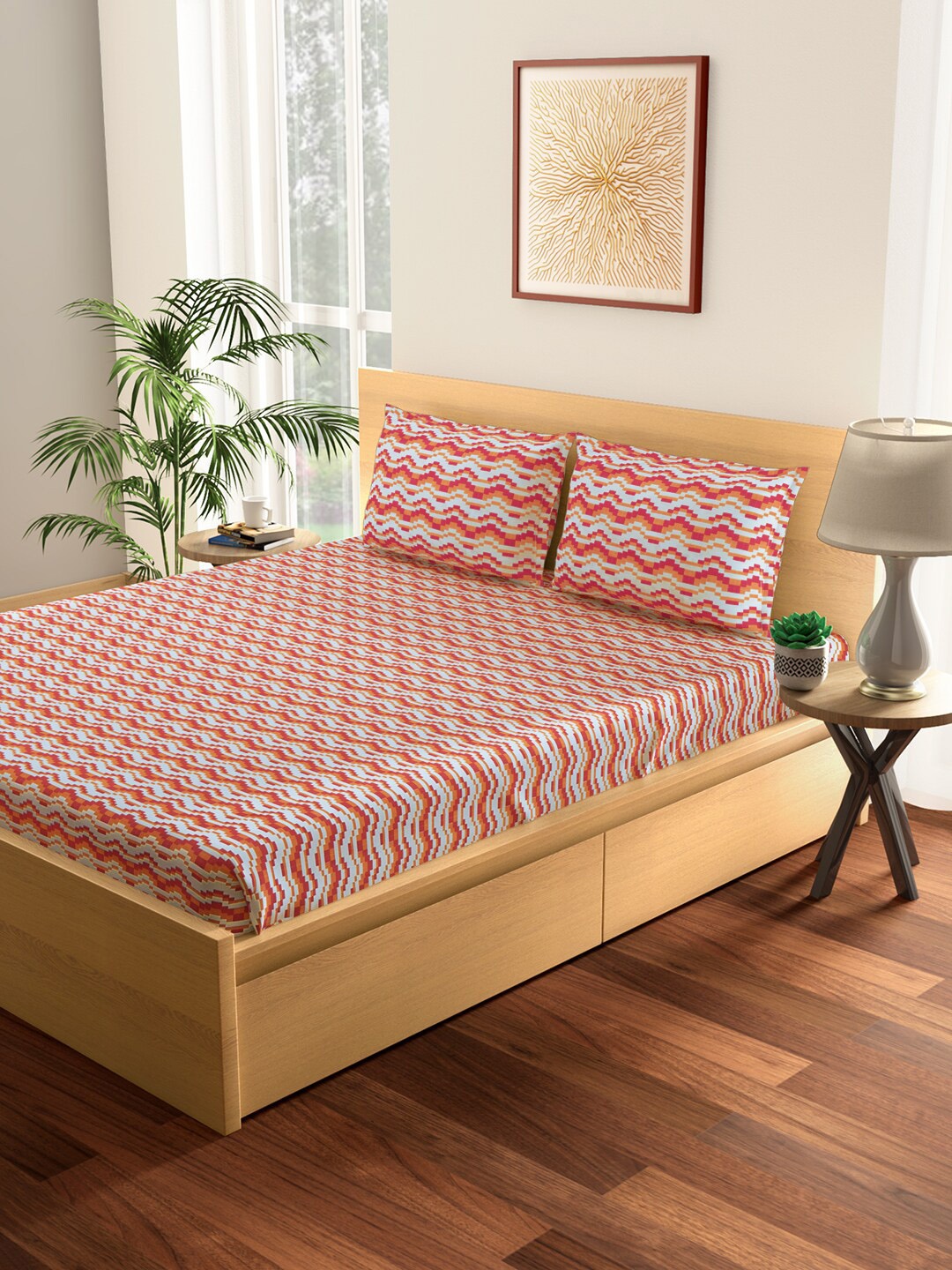 

Living scapes by Pantaloons Red & Orange Geometric 144 TC King Bedsheet with 2 Pillow Covers