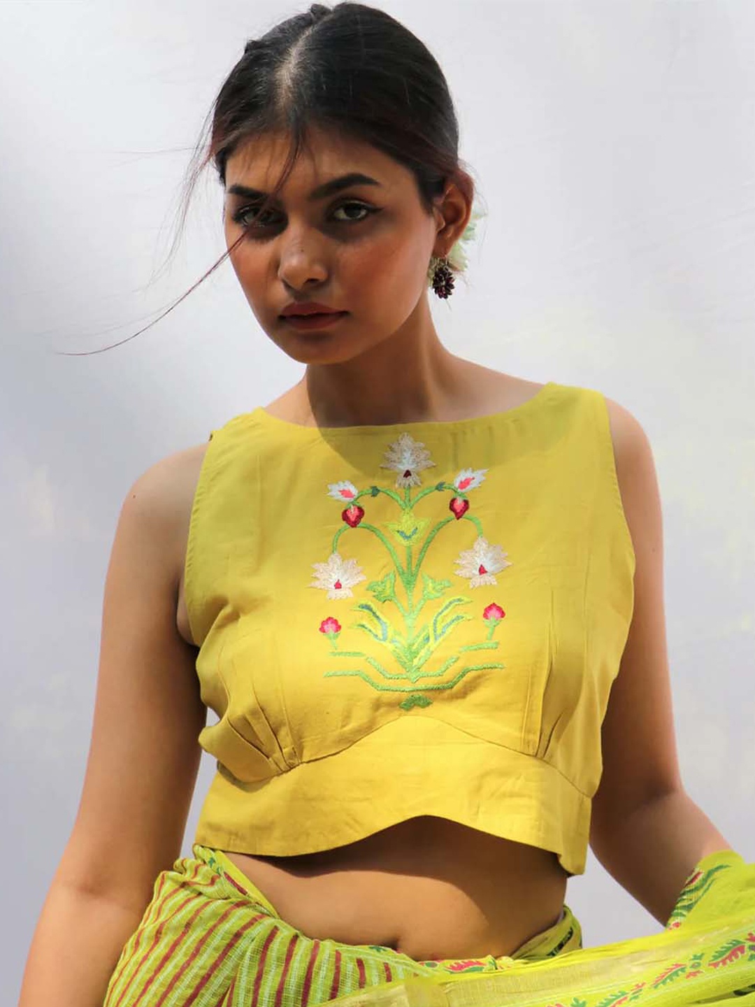 

Chidiyaa Women Yellow Embroidered Sleeveless Saree Blouse