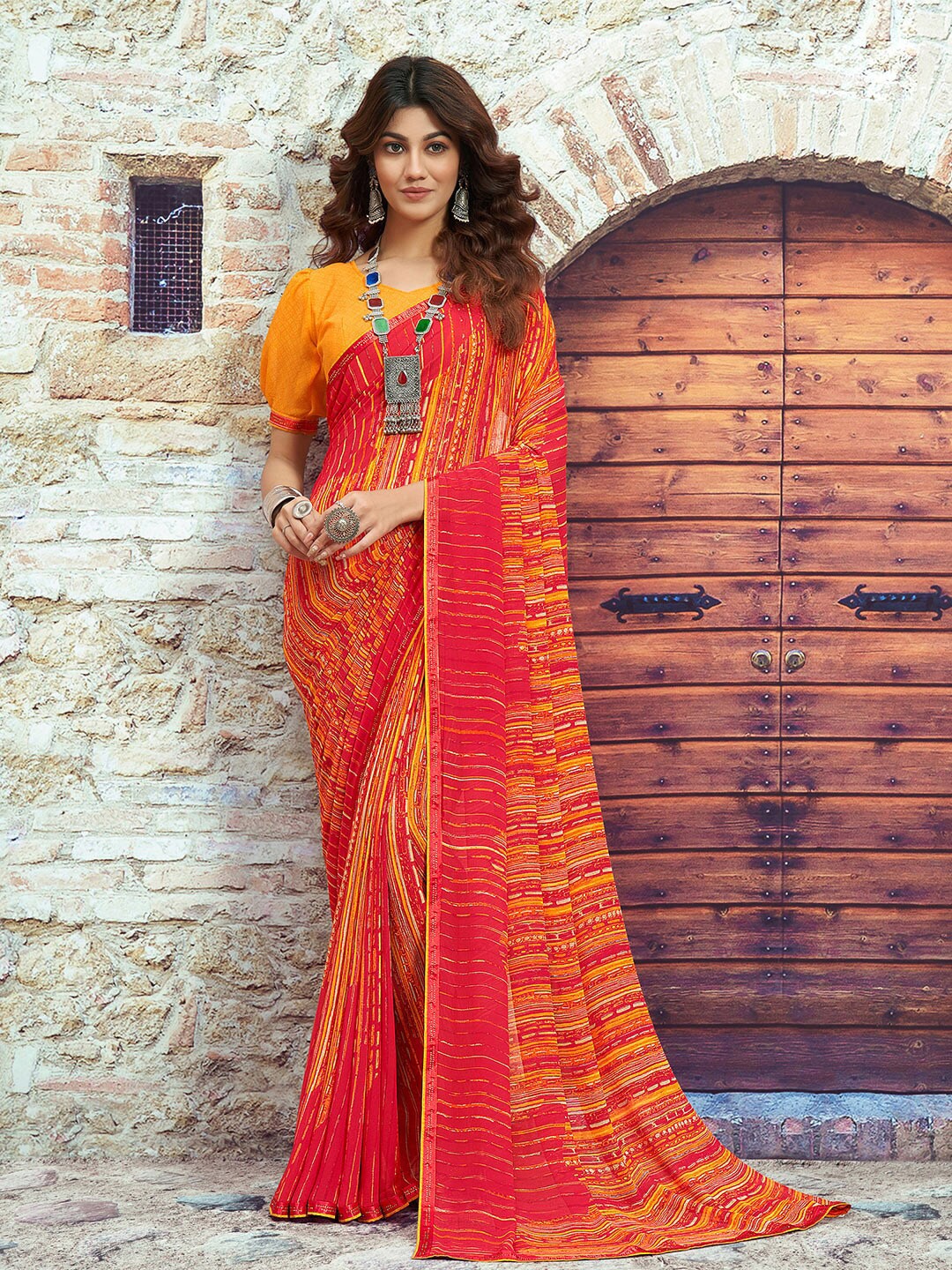 

Shaily Red & Orange Striped Beads and Stones Pure Georgette Saree