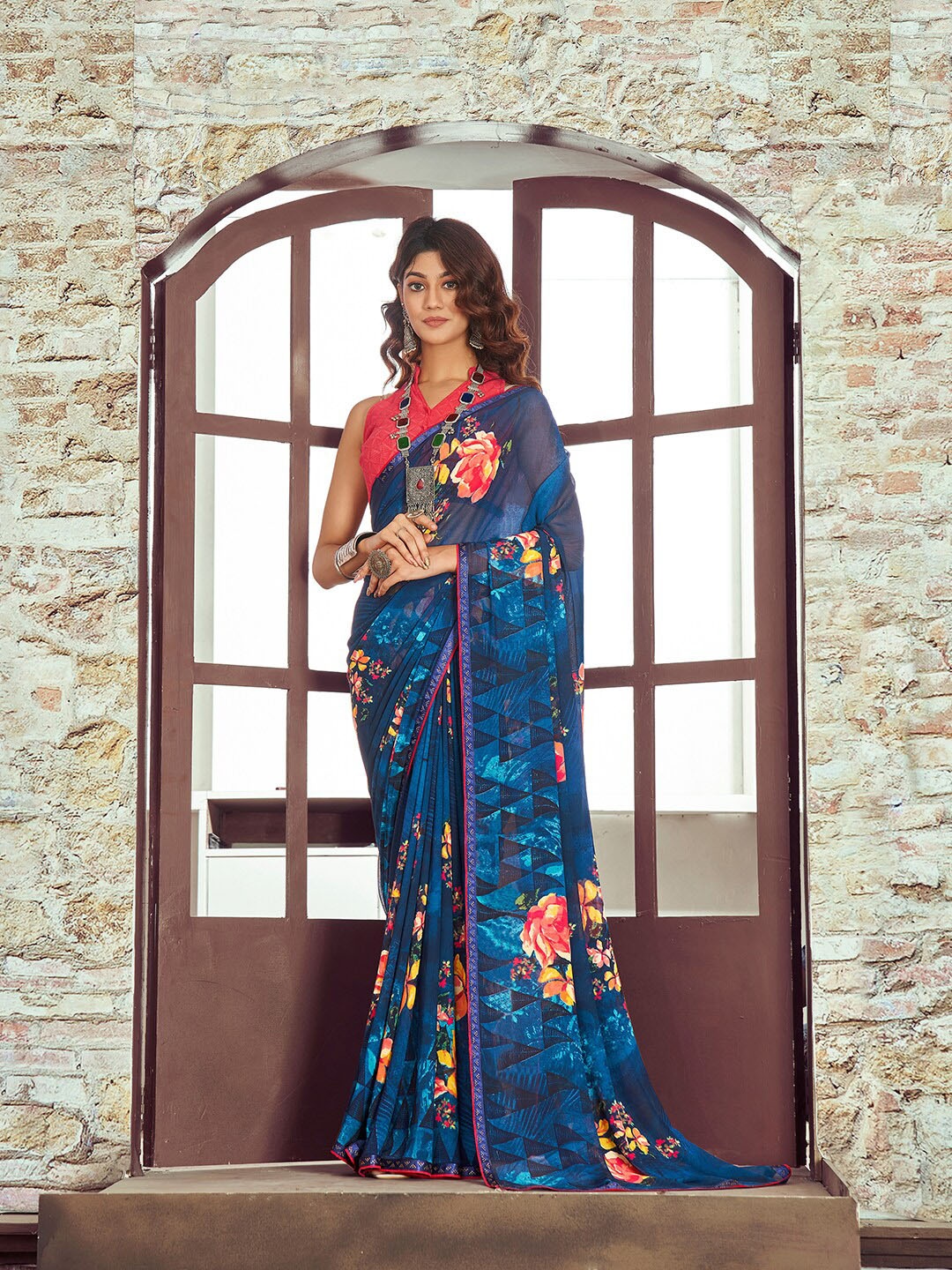 

Shaily Navy Blue & Orange Floral Beads and Stones Pure Georgette Saree