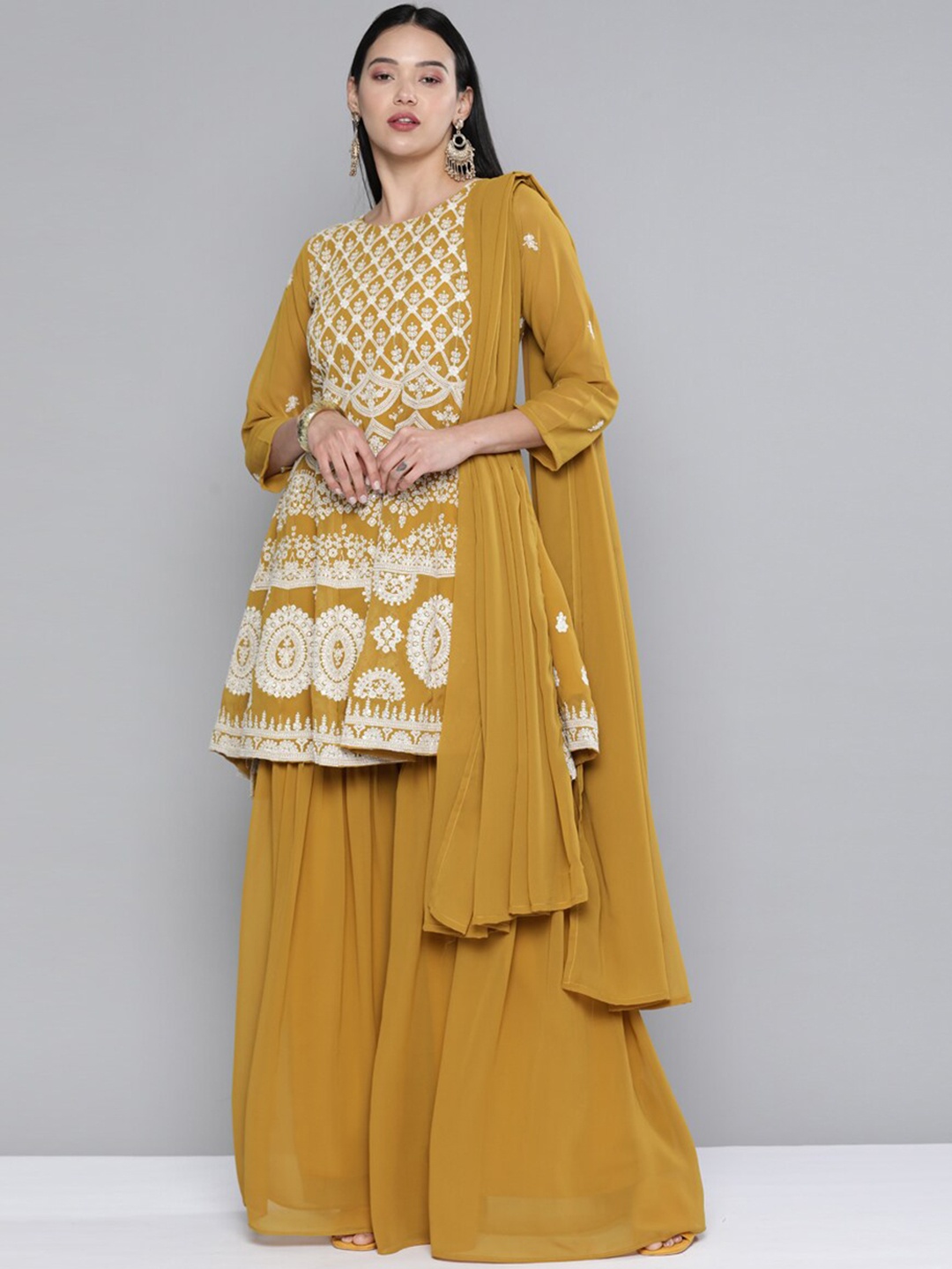 

Kvsfab Women Mustard Yellow Ethnic Motifs Embroidered Thread Work Kurta with Sharara & With Dupatta