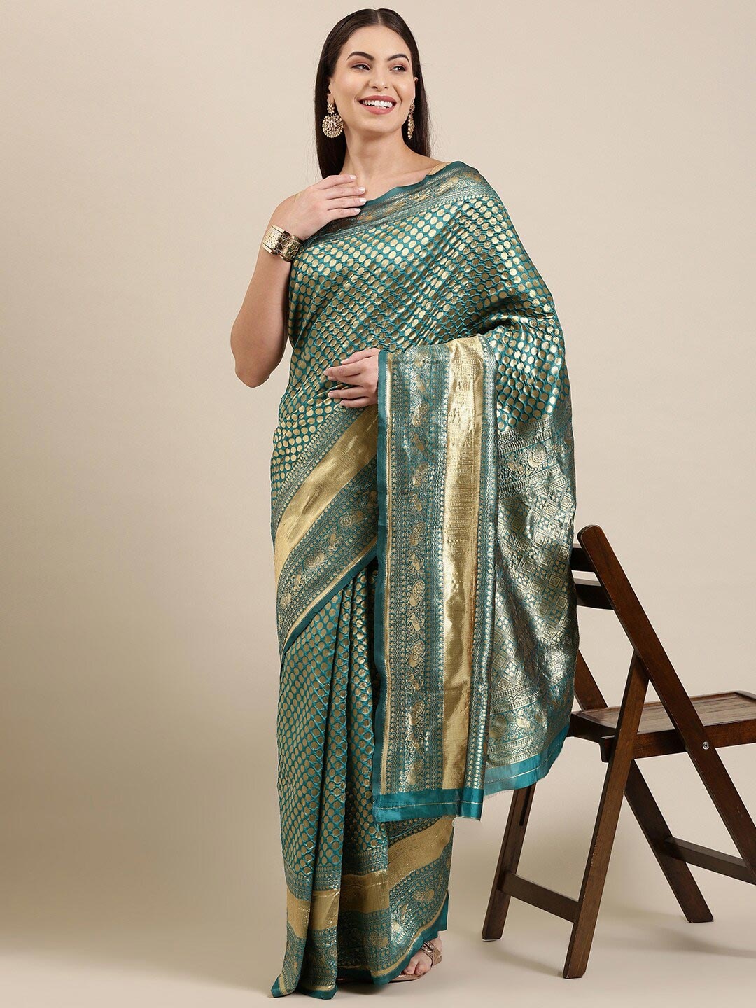 

The Chennai Silks Green & Gold-Toned Woven Design Zari Silk Blend Patola Saree