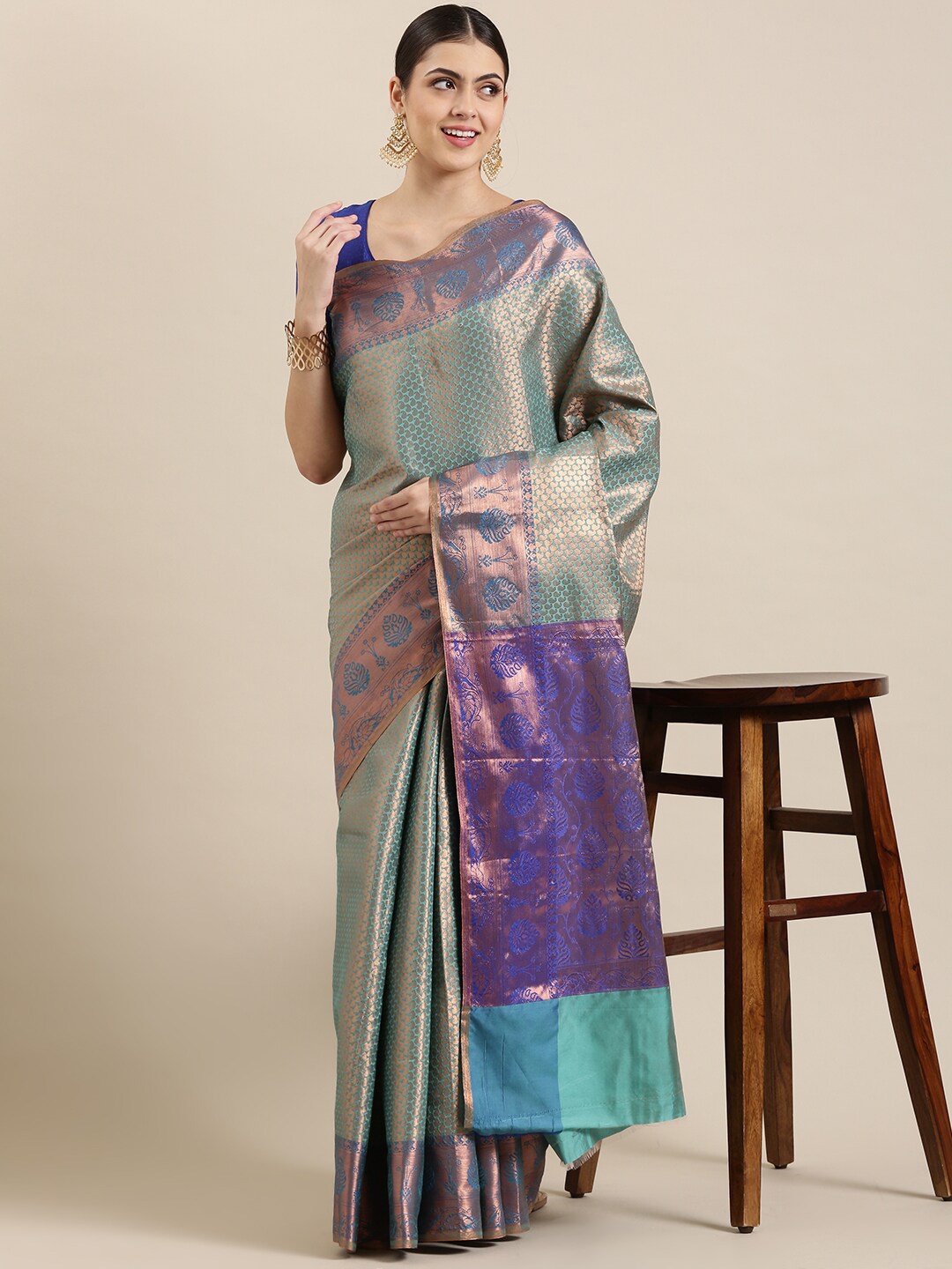 

The Chennai Silks Turquoise Blue & Purple Floral Zari Art Silk Kanjeevaram Saree