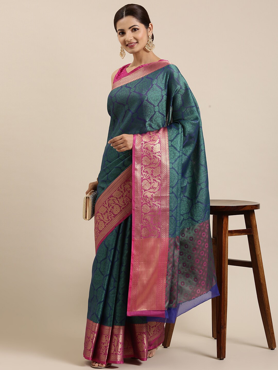 

The Chennai Silks Teal & Pink Ethnic Motifs Zari Organza Banarasi Saree