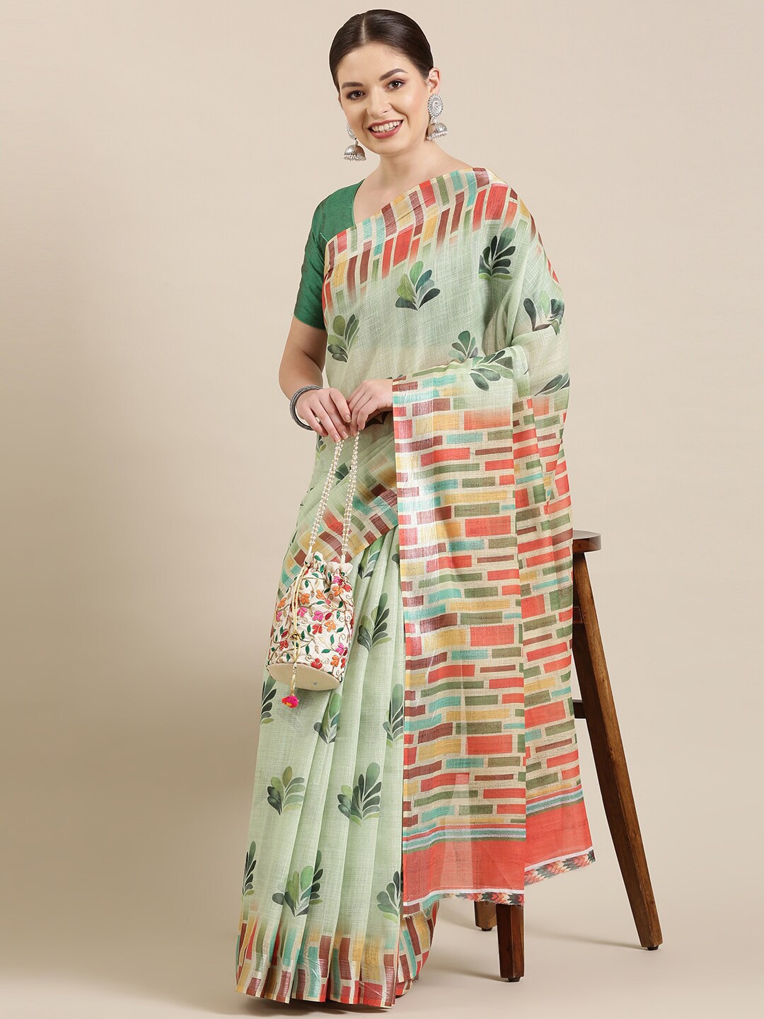 

The Chennai Silks Green & Pink Floral Zari Linen Blend Saree