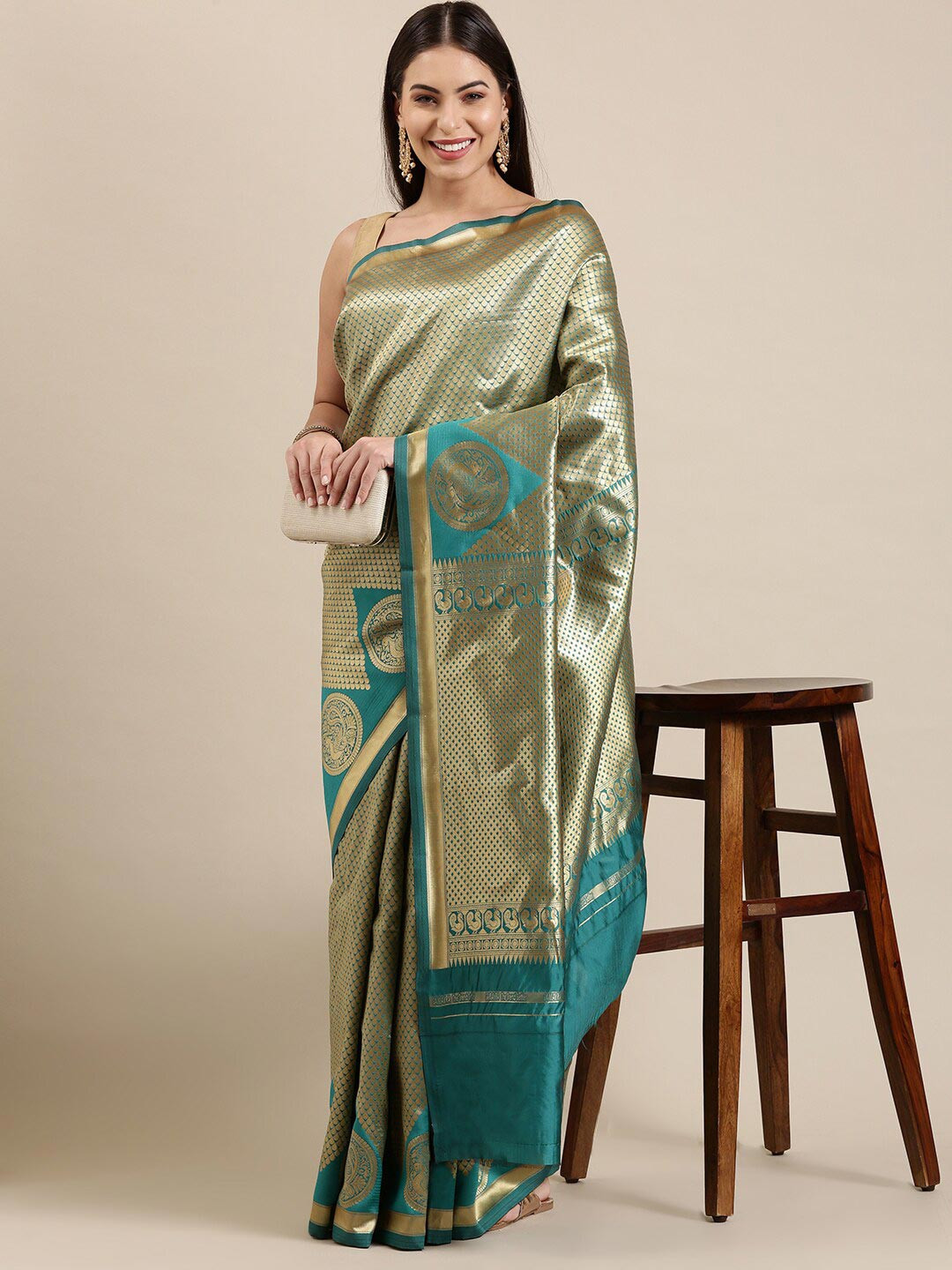 

The Chennai Silks Blue & Gold-Toned Ethnic Motifs Zari Silk Blend Patola Saree