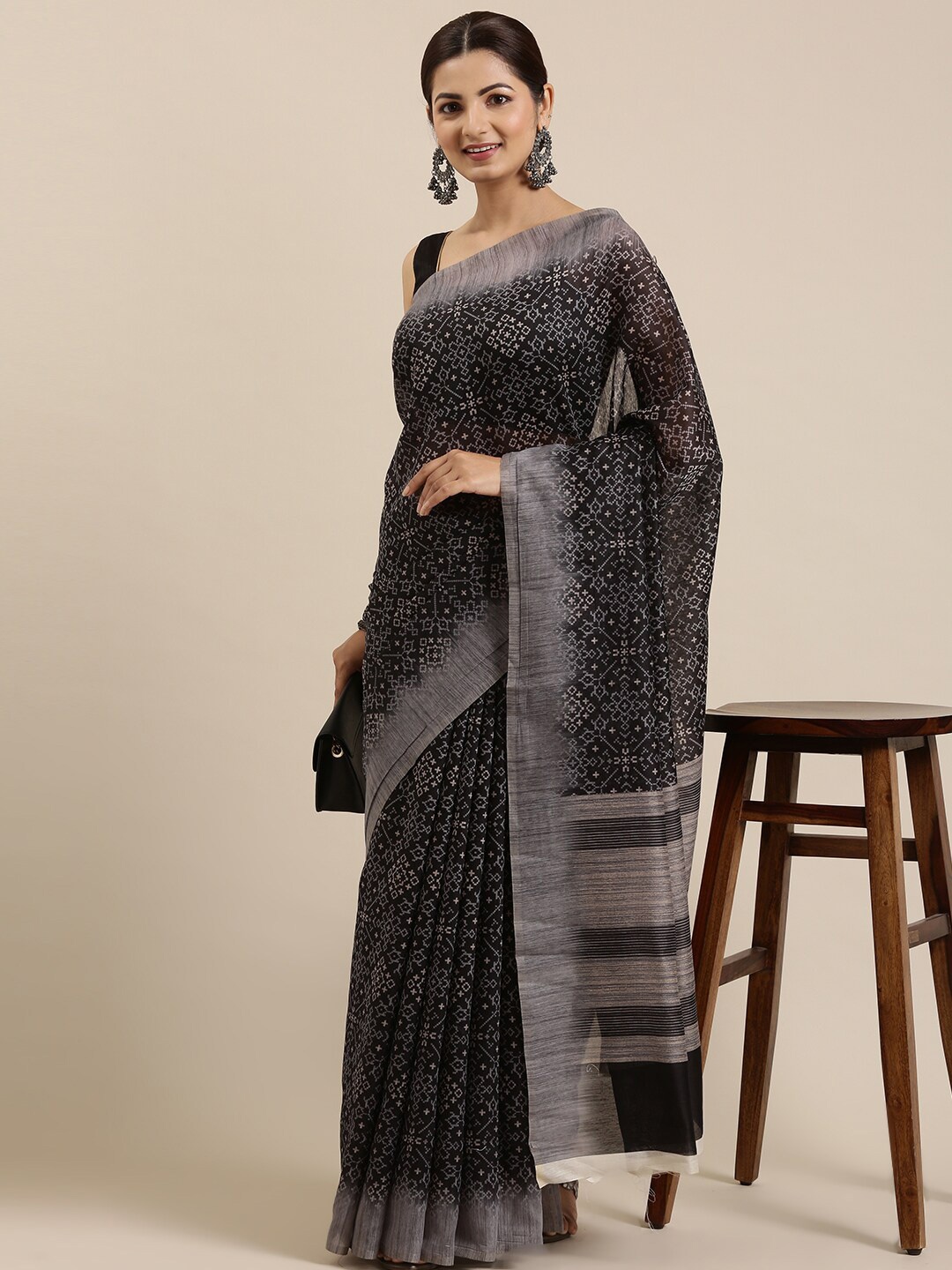 

The Chennai Silks Black & White Ethnic Motifs Zari Chanderi Saree