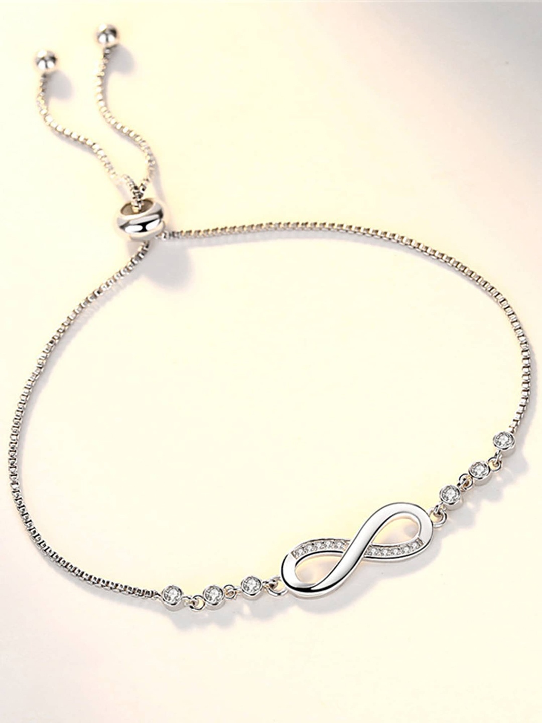 

Vembley Women Silver-Toned & White Cubic Zirconia Silver-Plated Kada Bracelet
