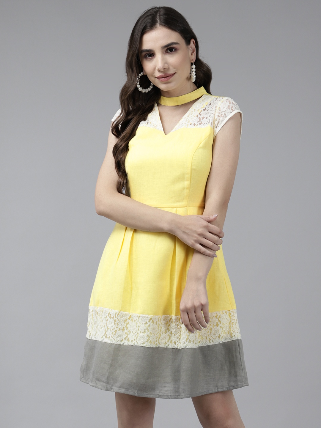 

Aarika Yellow & White Colourblocked Choker Neck Georgette A-Line Mini Dress