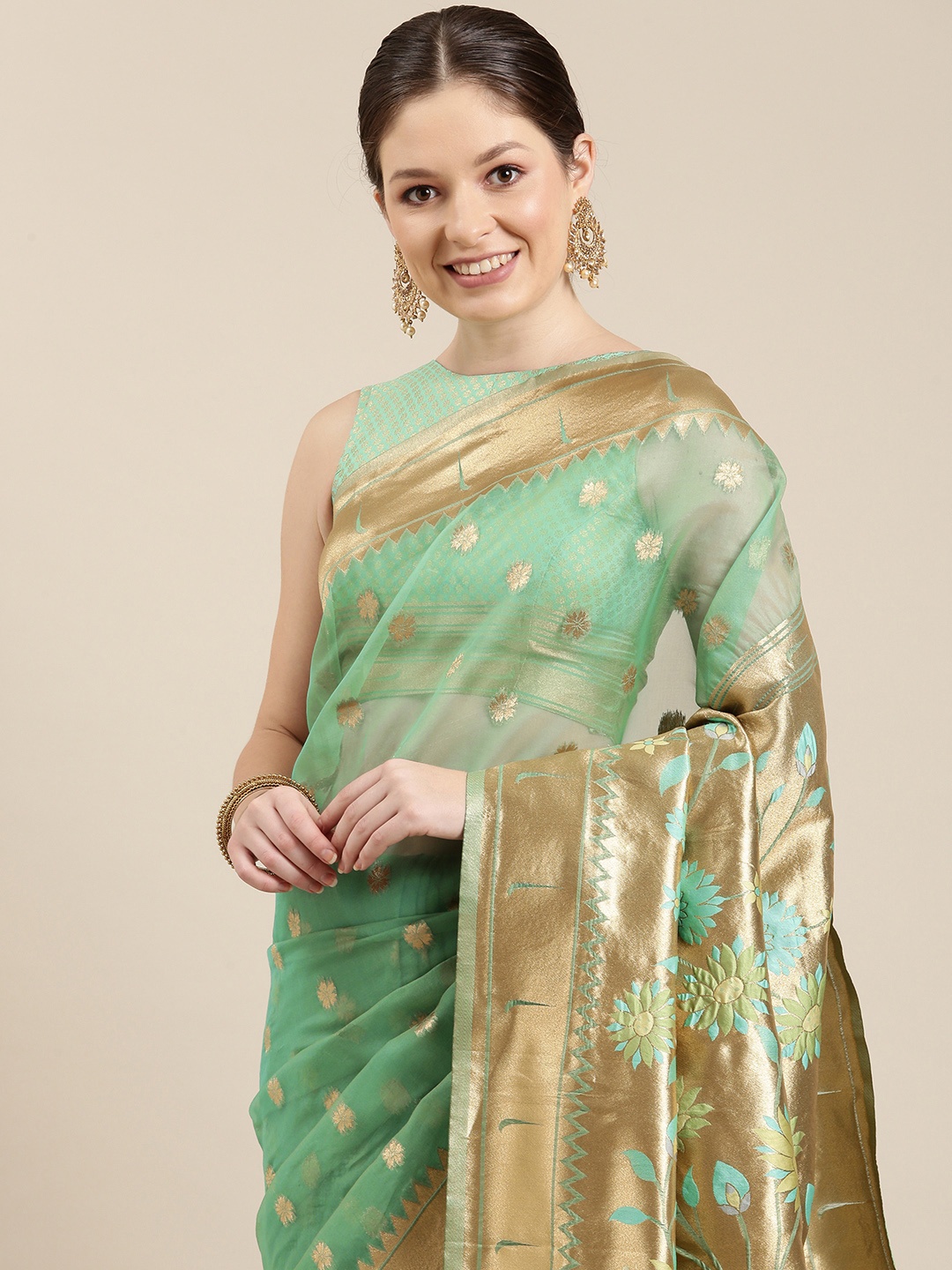 

panchhi Green & Golden Ethnic Motifs Zari Organza Banarasi Saree