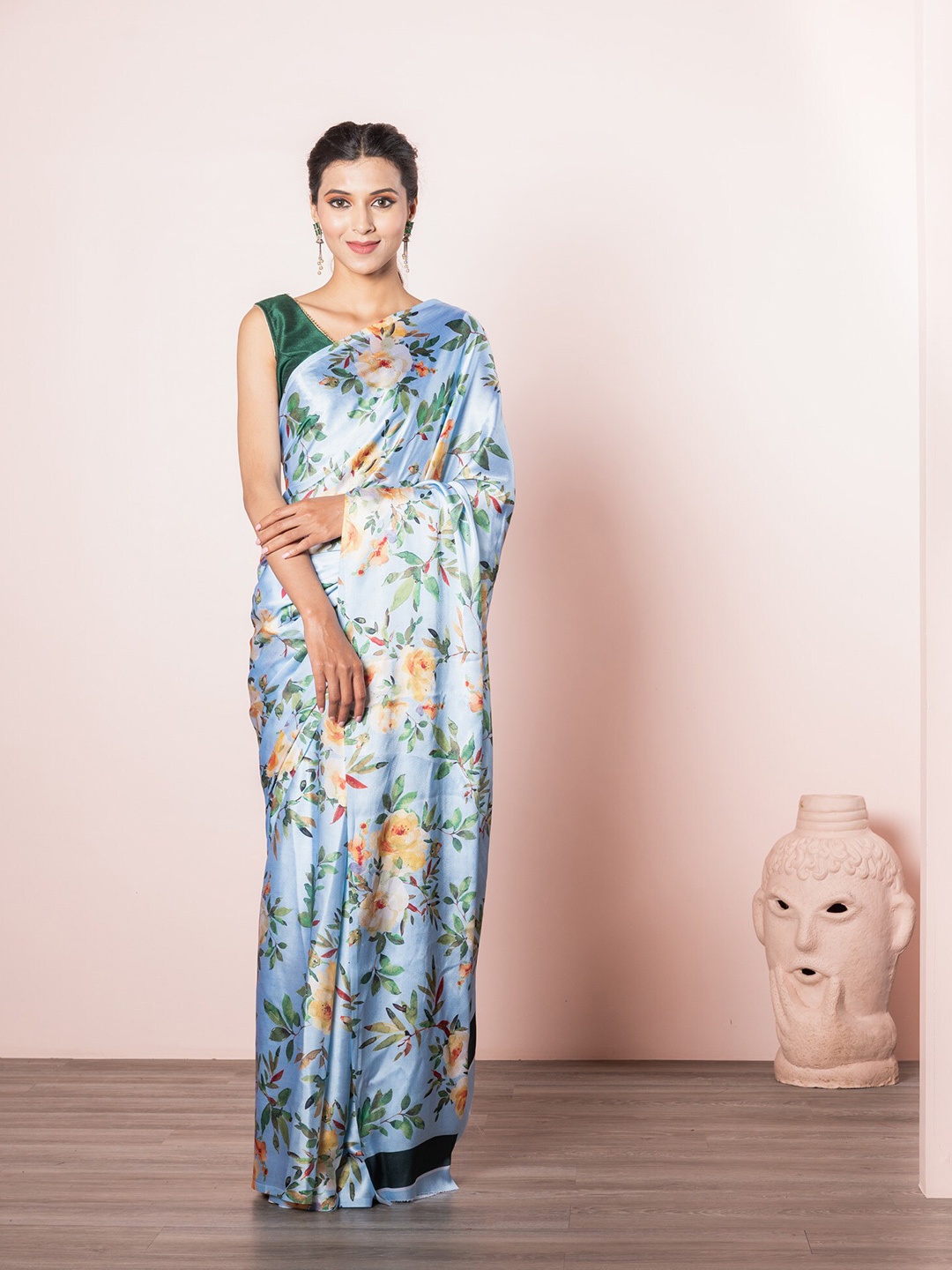 

Exclusiva Blue & Peach Coloured Floral Saree