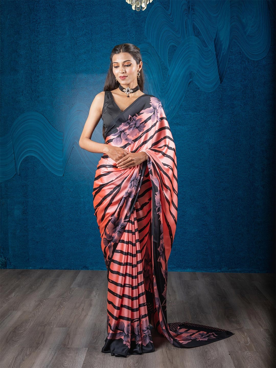 

Exclusiva Peach-Coloured & Black Floral Saree