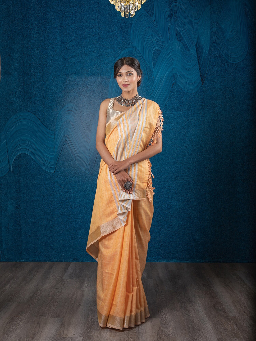 

Exclusiva Orange Striped Silver Zari Border Linen Blend Saree