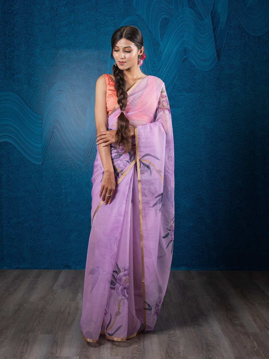 

Exclusiva Purple & Green Floral Zari Organza Saree