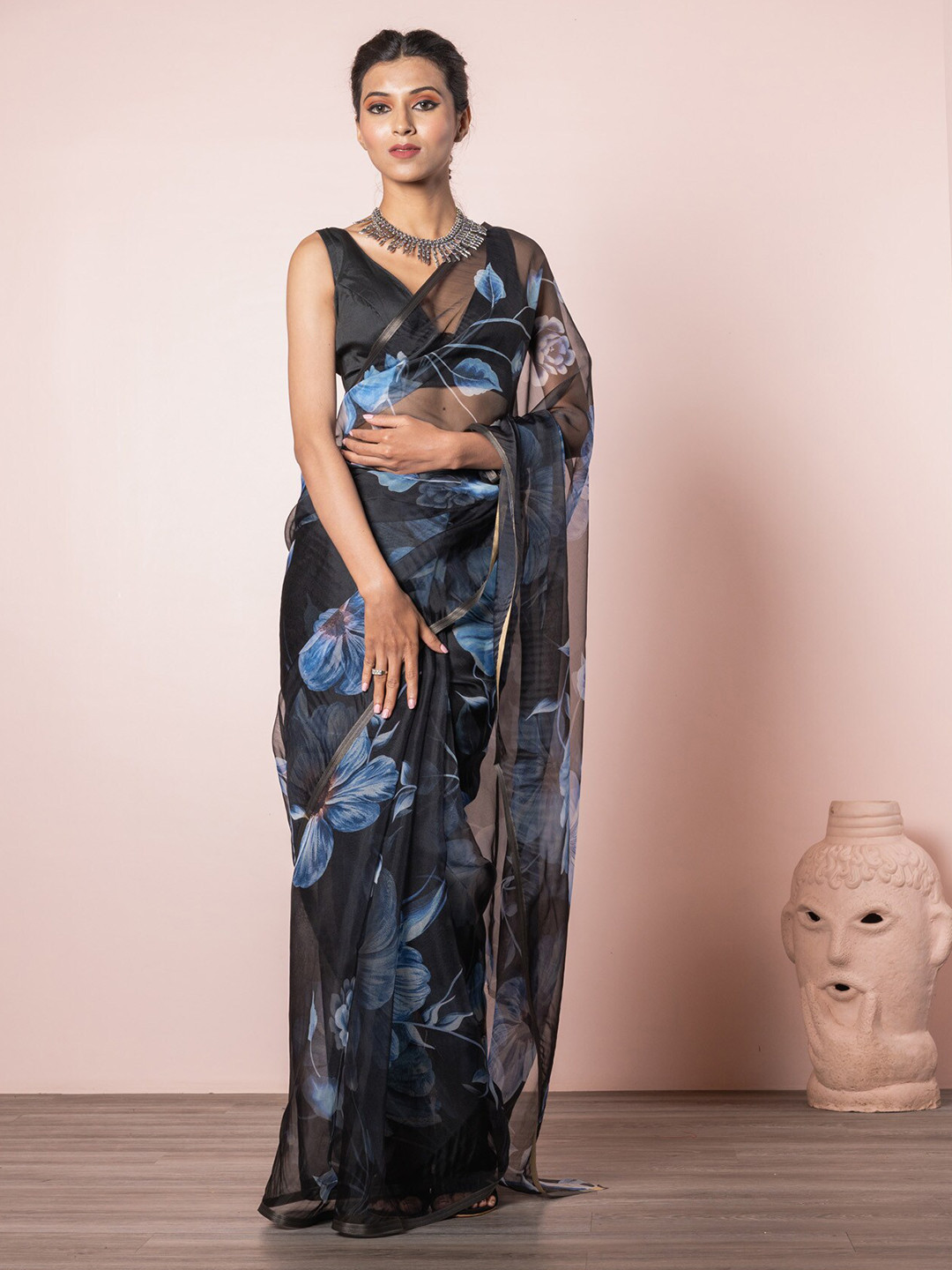 

Exclusiva Women Black & Blue Floral Organza Saree