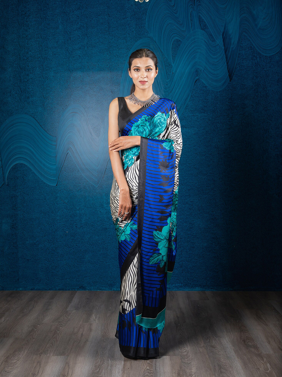 

Exclusiva Blue & White Floral Printed Satin Crepe Saree